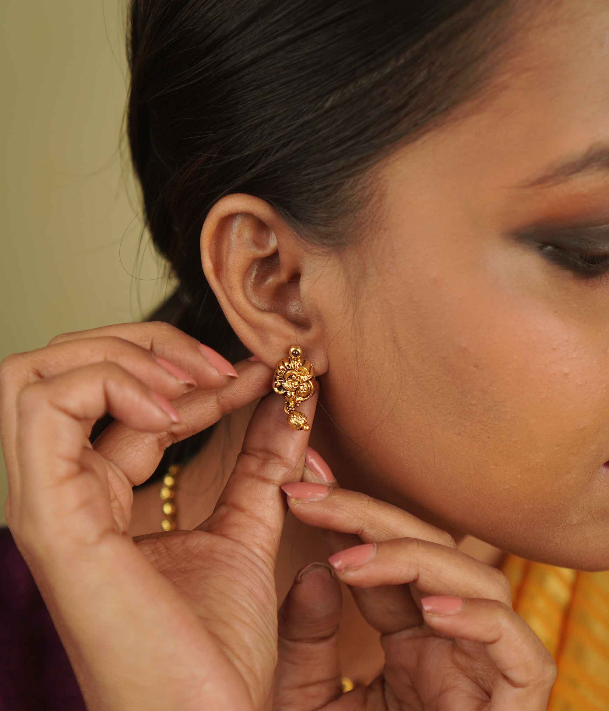 Ojal Earrings: Where tradition meets contemporary charm. Gold-plated silver with red spinel stones, blending temple artistry with modern minimalism.