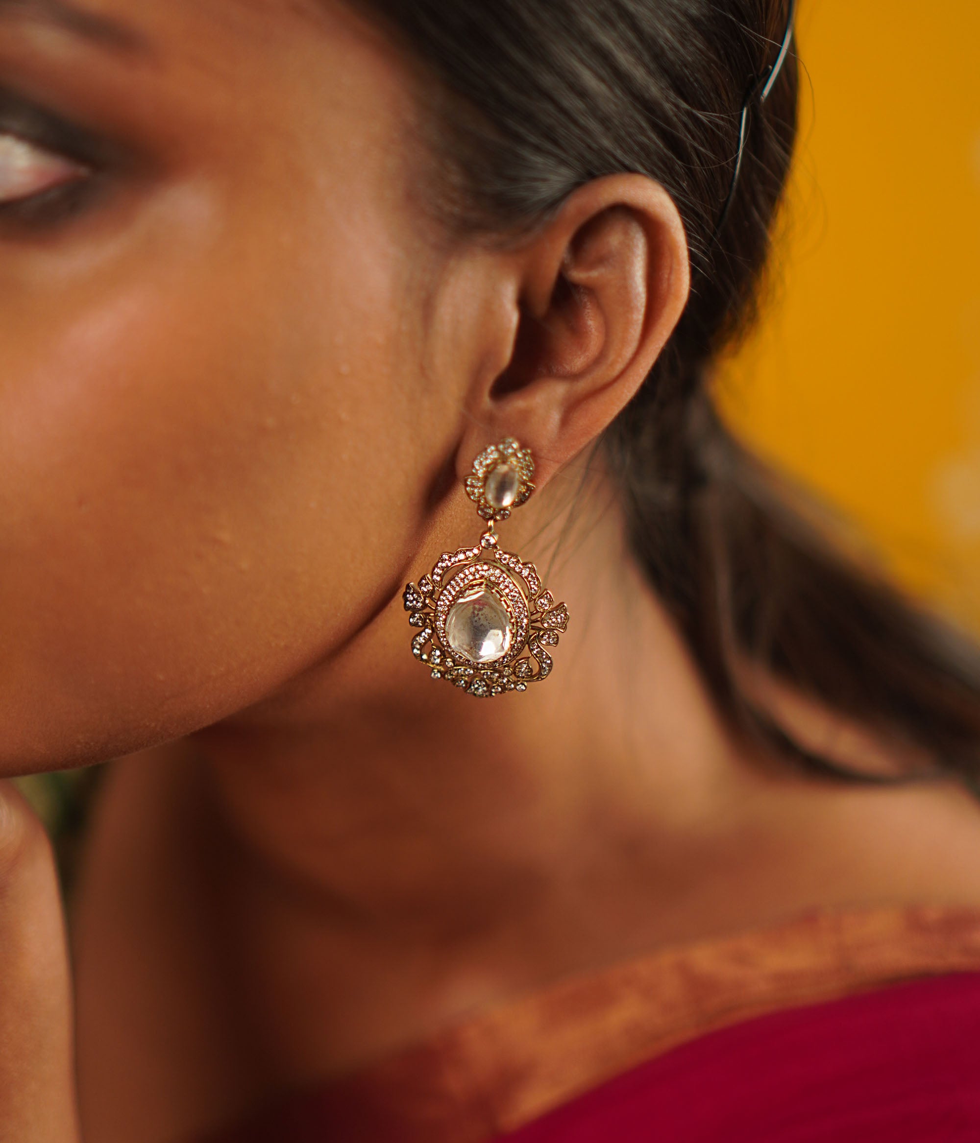 A timeless mini heirloom, these gold-plated silver drop earrings feature radiant Polki and CZ stones, blending classic craftsmanship with modern elegance.