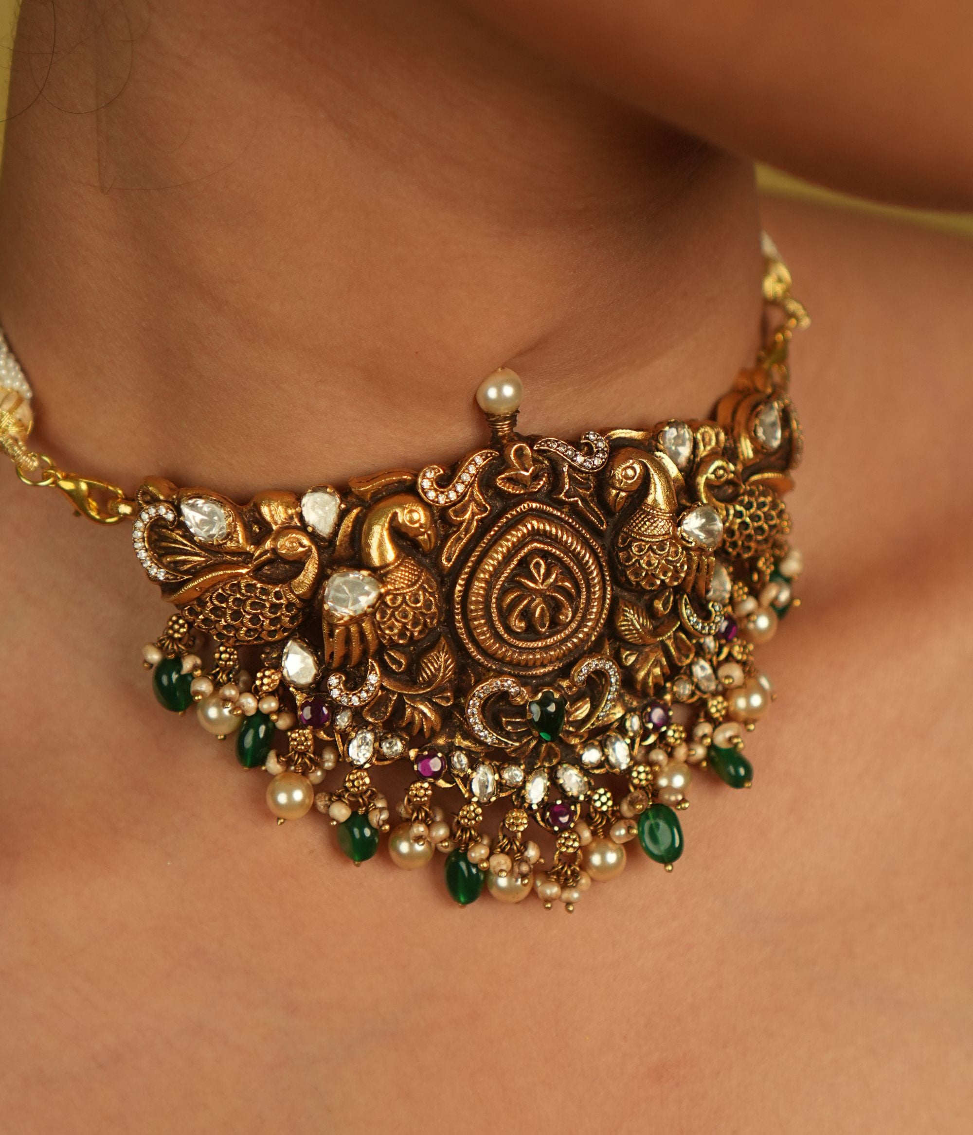 Traditional gold-plated silver necklace with green beads and Polki stones