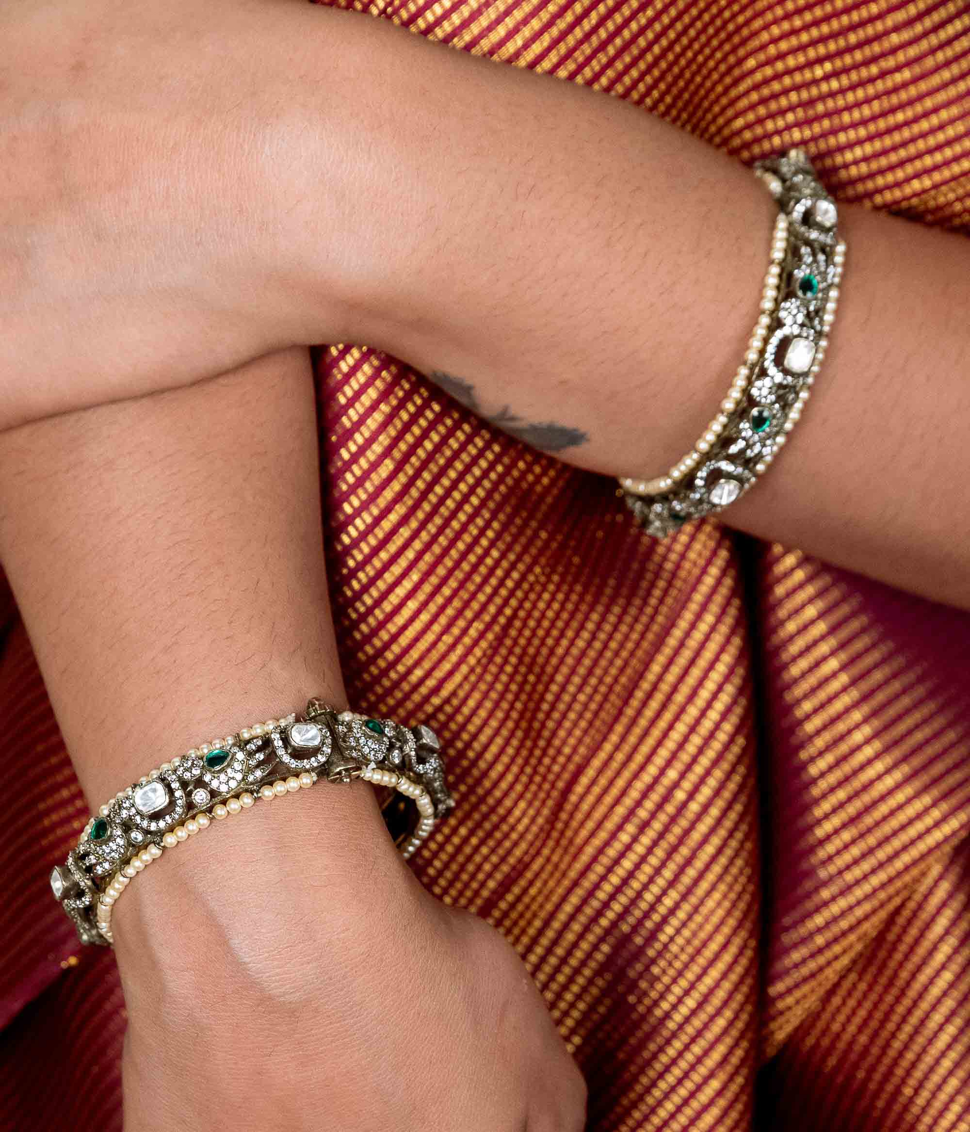Festive silver Polki bangle for women with gemstone accents