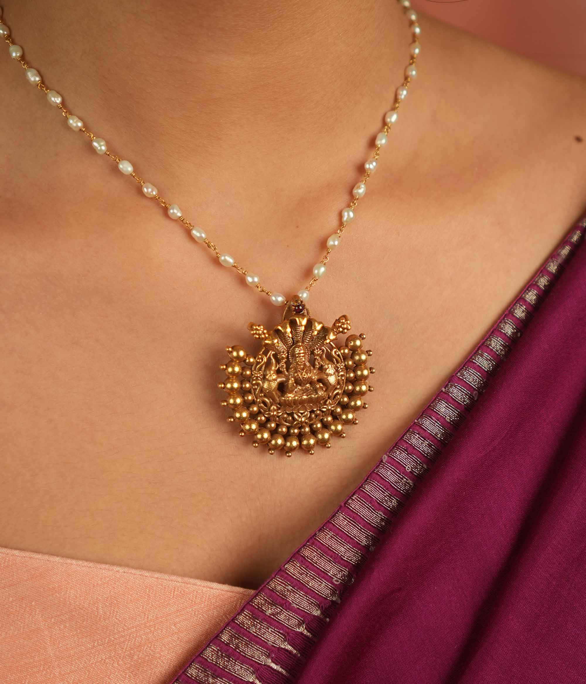 Divine whispers reborn! Gold-plated temple pendant with Goddess Lakshmi radiates faith and timeless devotion.