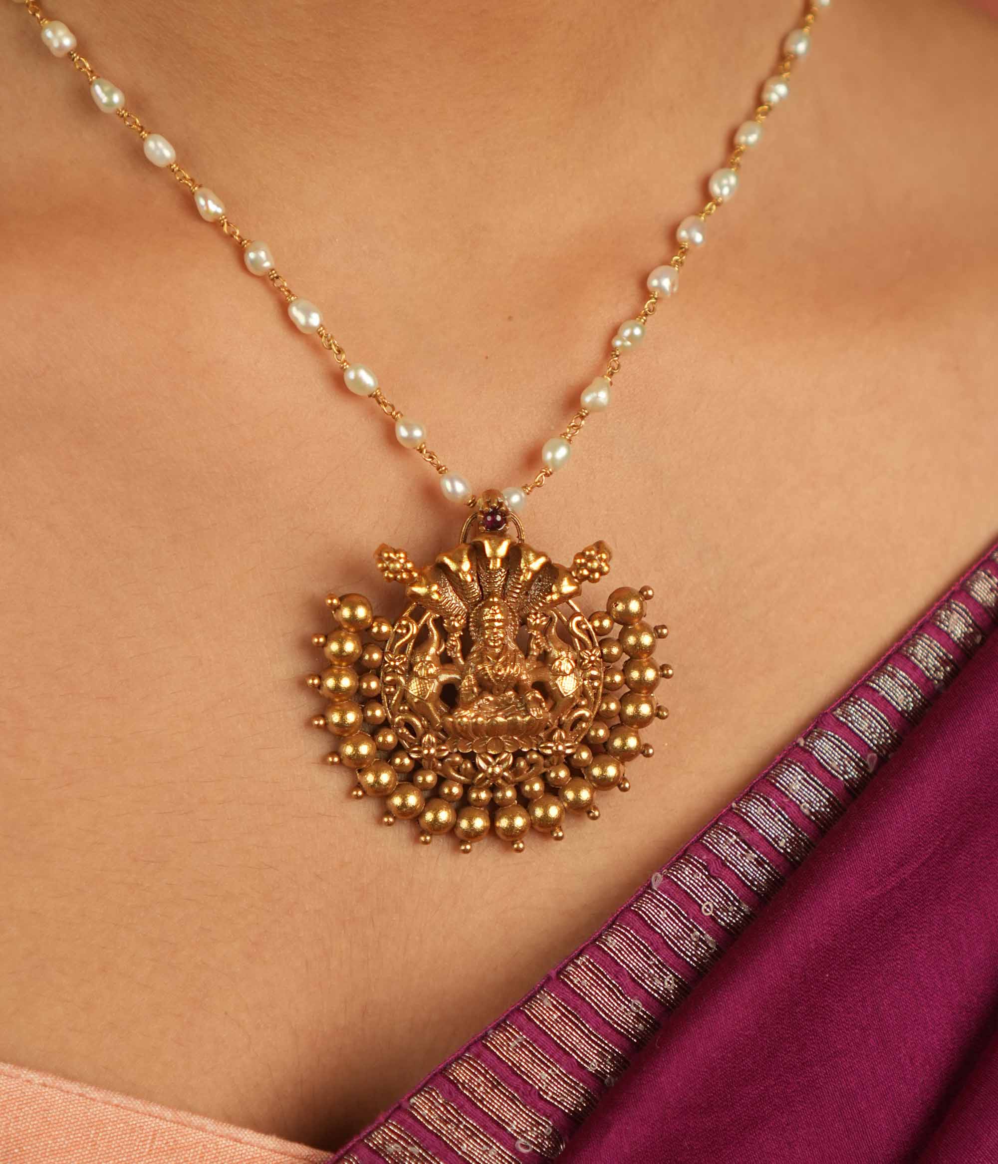 Divine whispers reborn! Gold-plated temple pendant with Goddess Lakshmi radiates faith and timeless devotion.