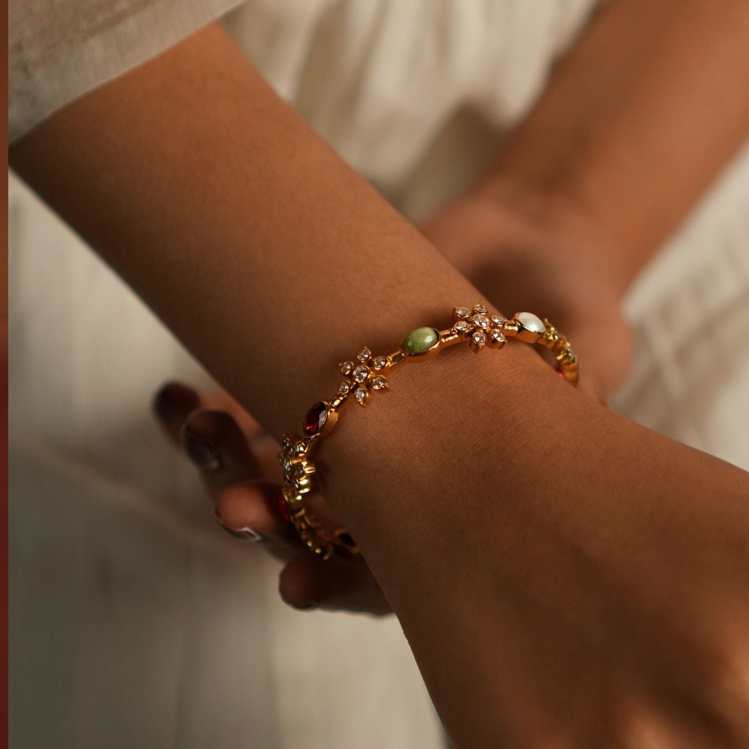 Handcrafted silver and gold bangle with shimmering CZ and Navratna stones Chennai,Traditional insert bangle with Navratna and CZ stones for women Chennai