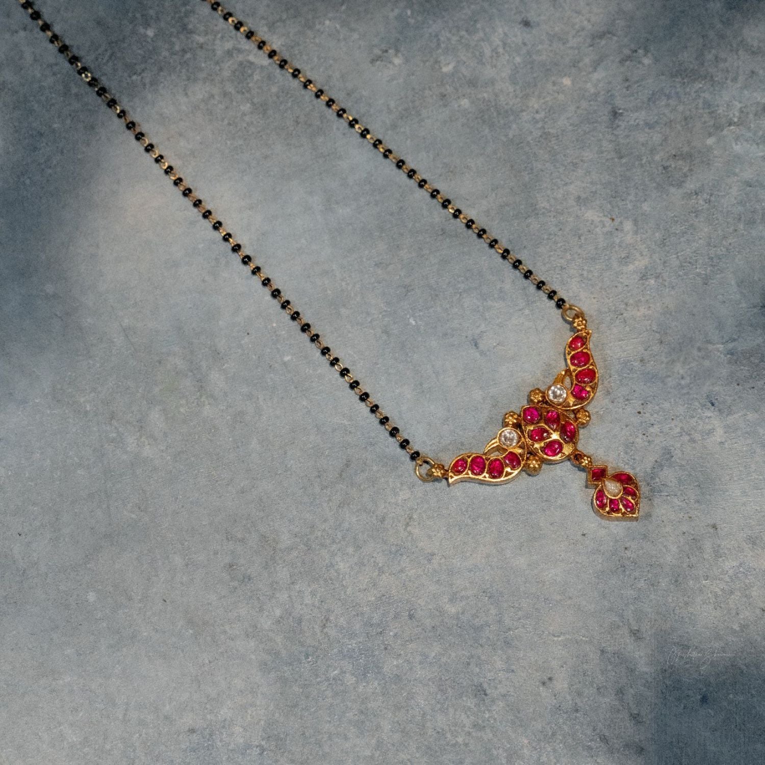 Amrutha kundan mangalsutra with red and white stones in silver,Chennai-made handcrafted silver mangalsutra with black beads