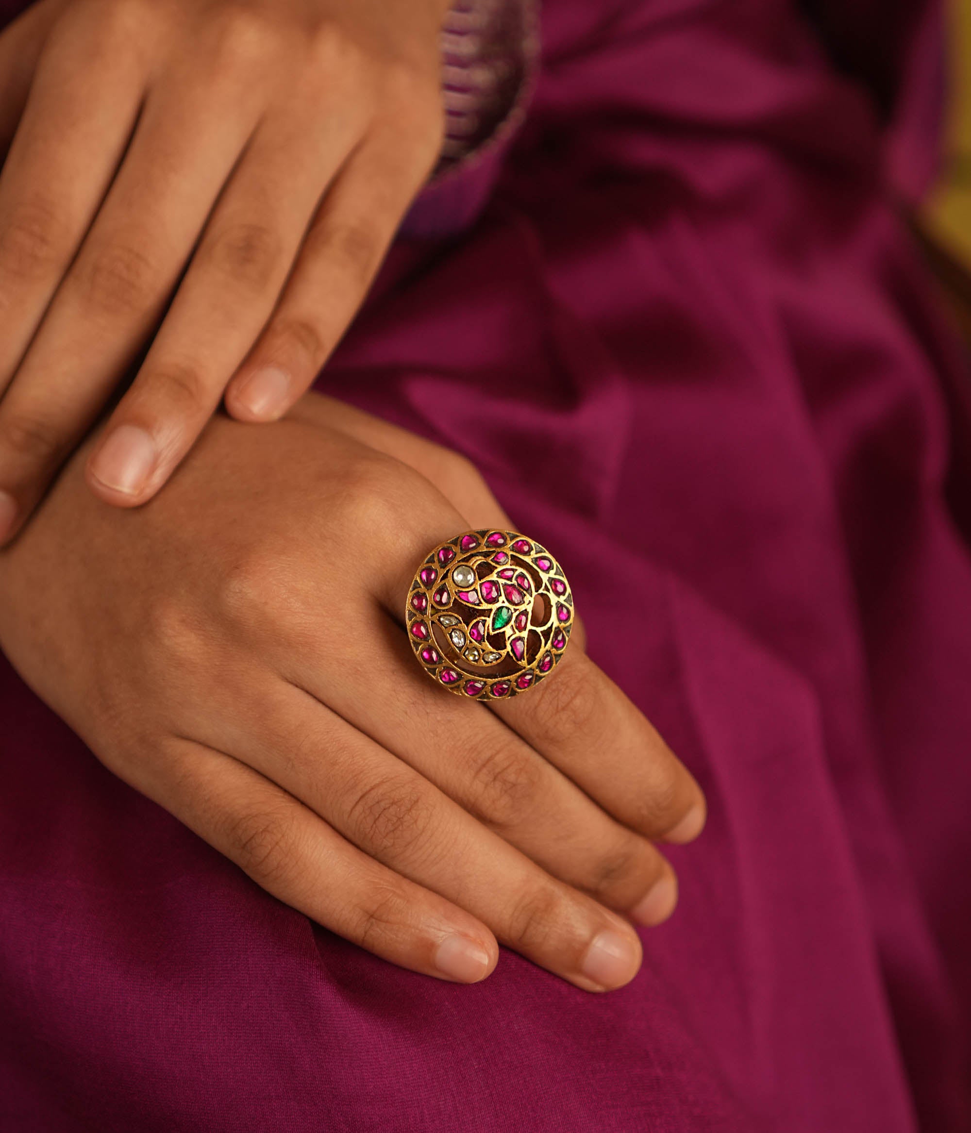 Majestic plumage reborn! This Kundan peacock ring dazzles with red, green, and white stones, echoing timeless grace and regal charm.