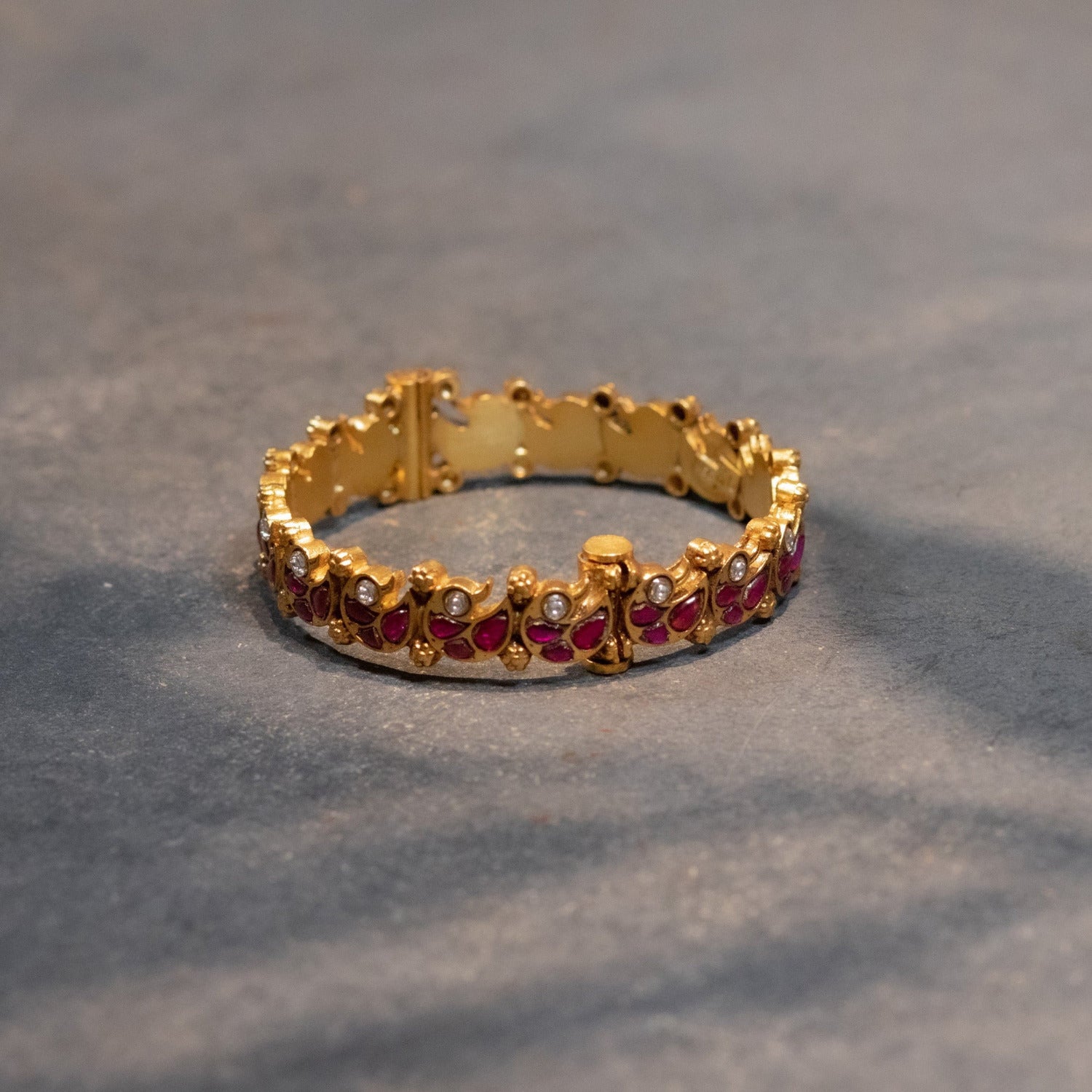Handmade silver kada with red and white Kundan stones