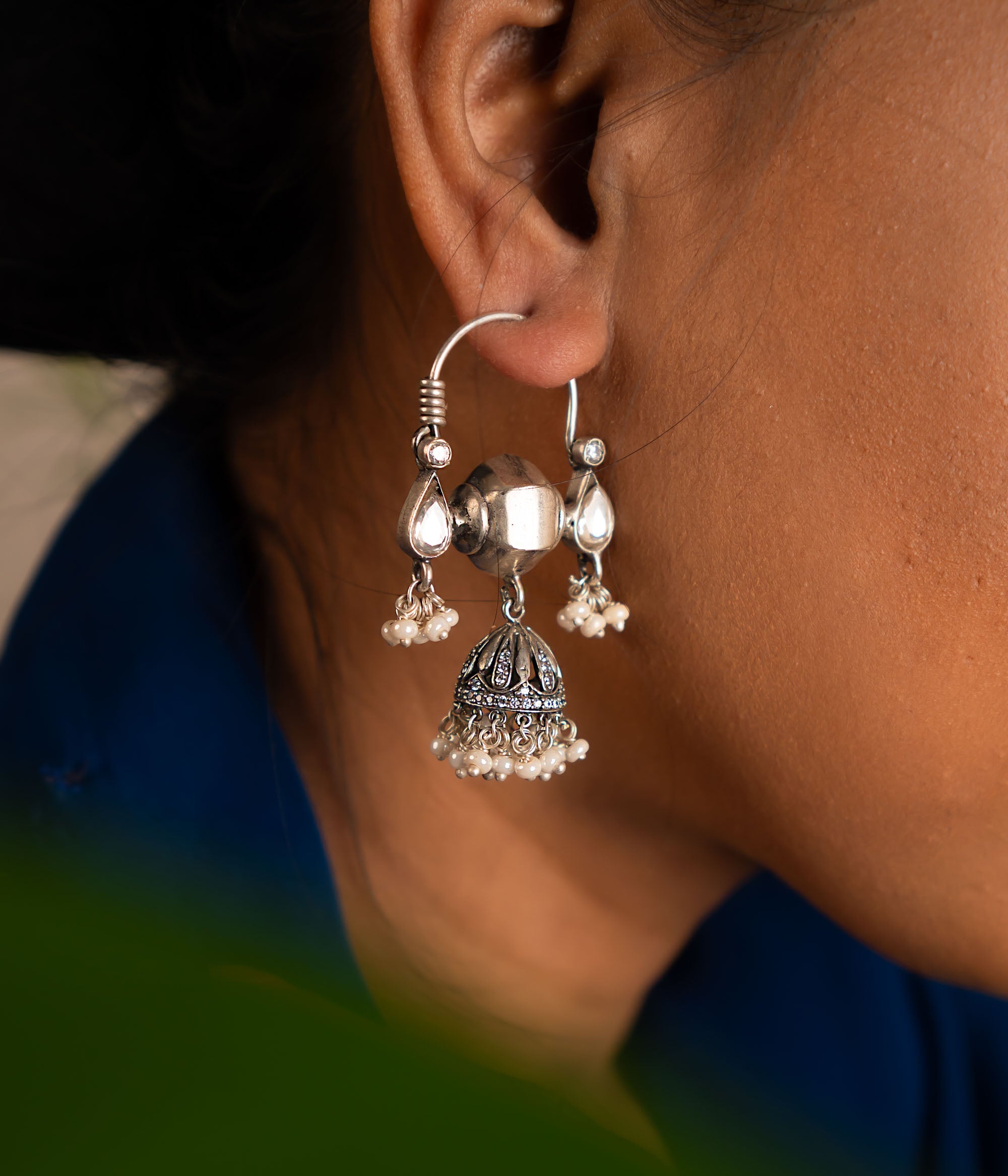 These dangler earrings, crafted with contemporary Indian motifs and techniques, beautifully capture the spirit of celebration and elegance.