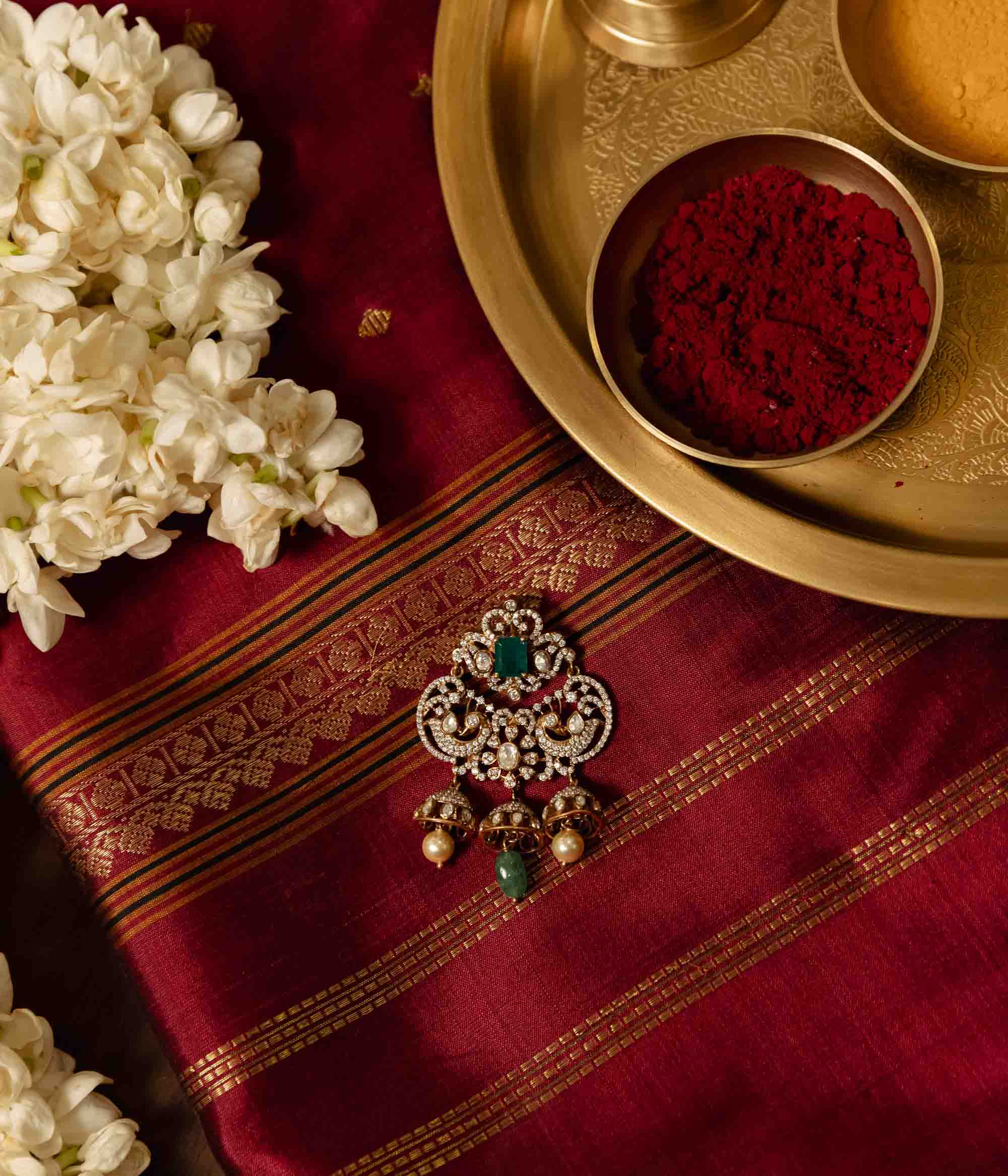 Antique gold-plated polki and green pendant for women.