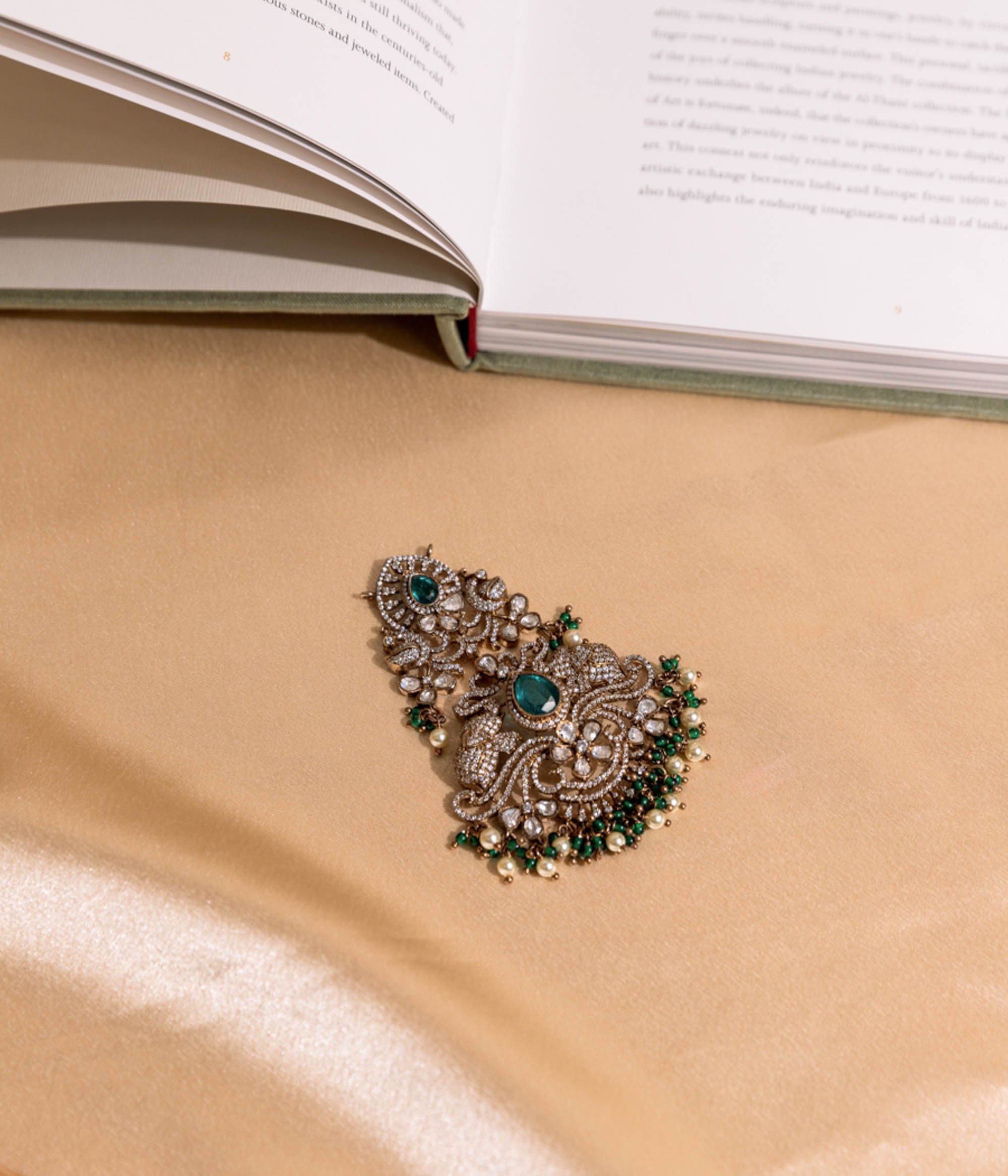 Traditional Indian pendant in antique finish with green beads