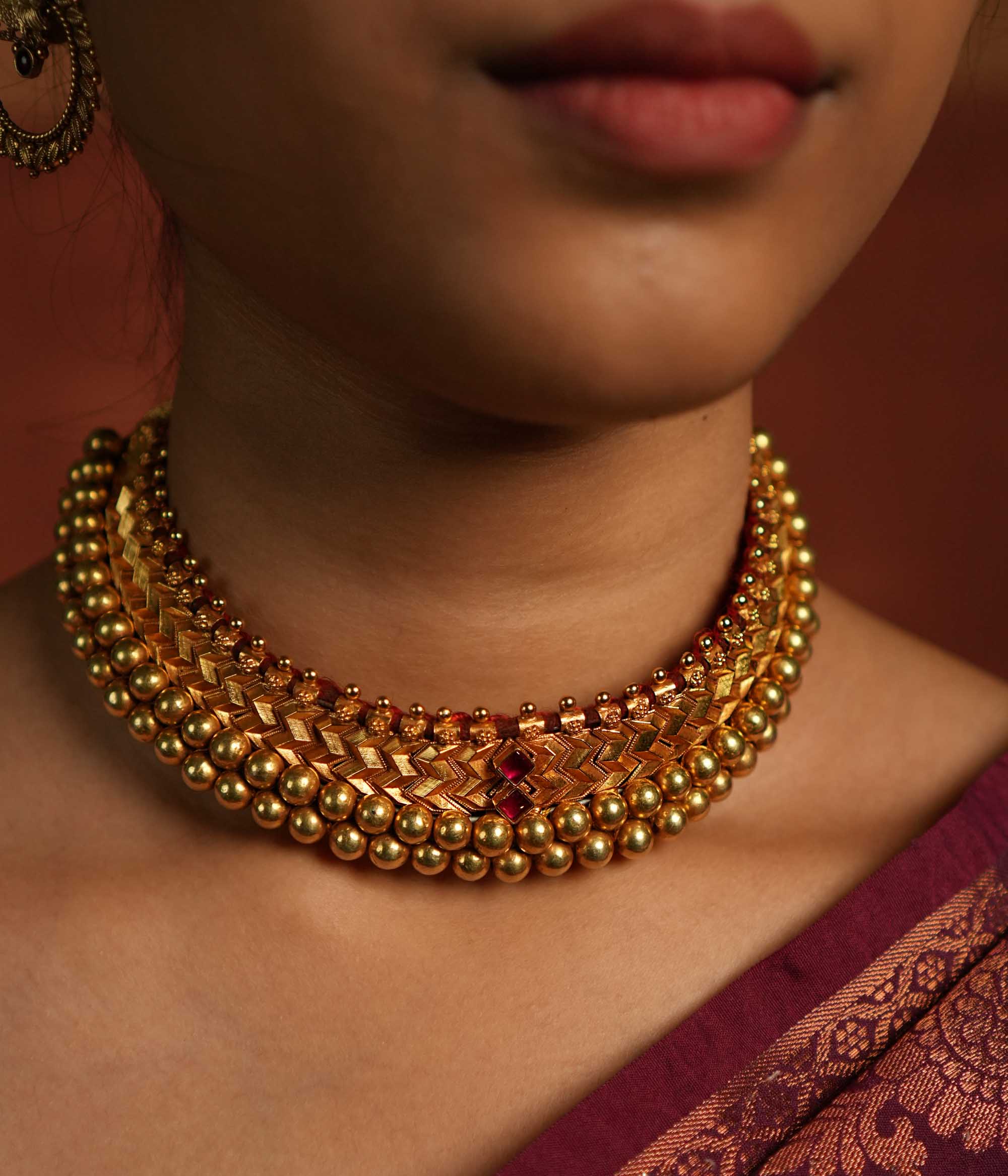 Traditional Indian necklace with gold polish and gemstone