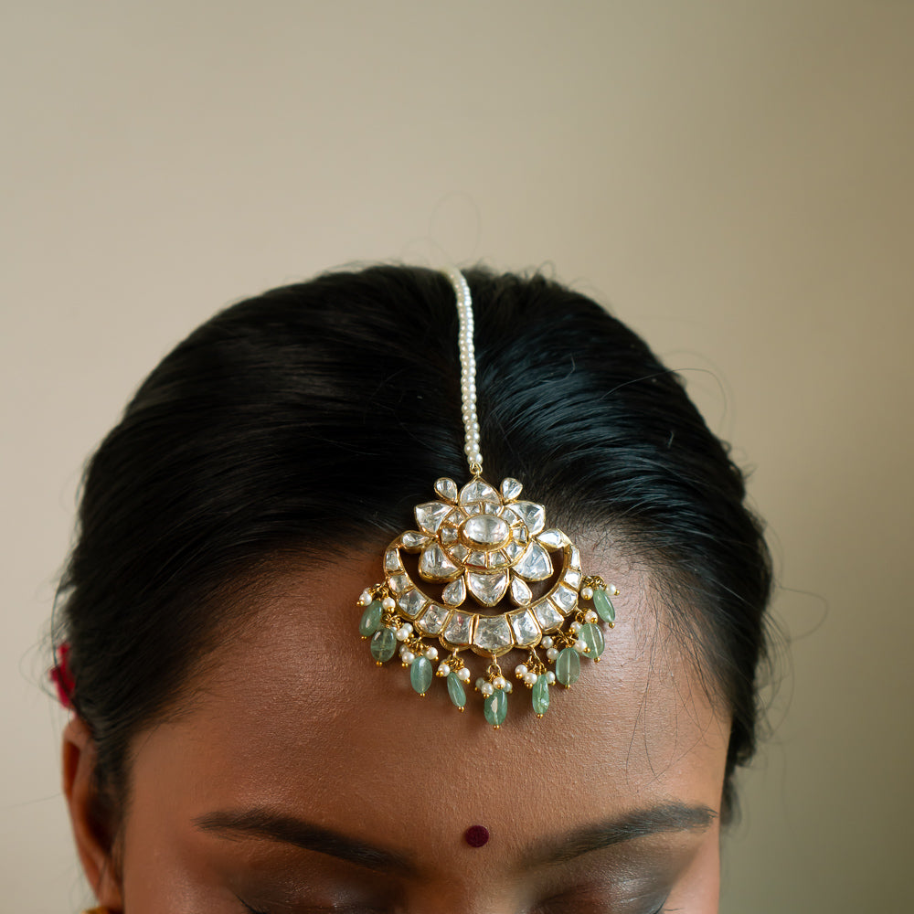 Crescent-shaped gold-plated silver earrings with Polki, pearls, and green beads