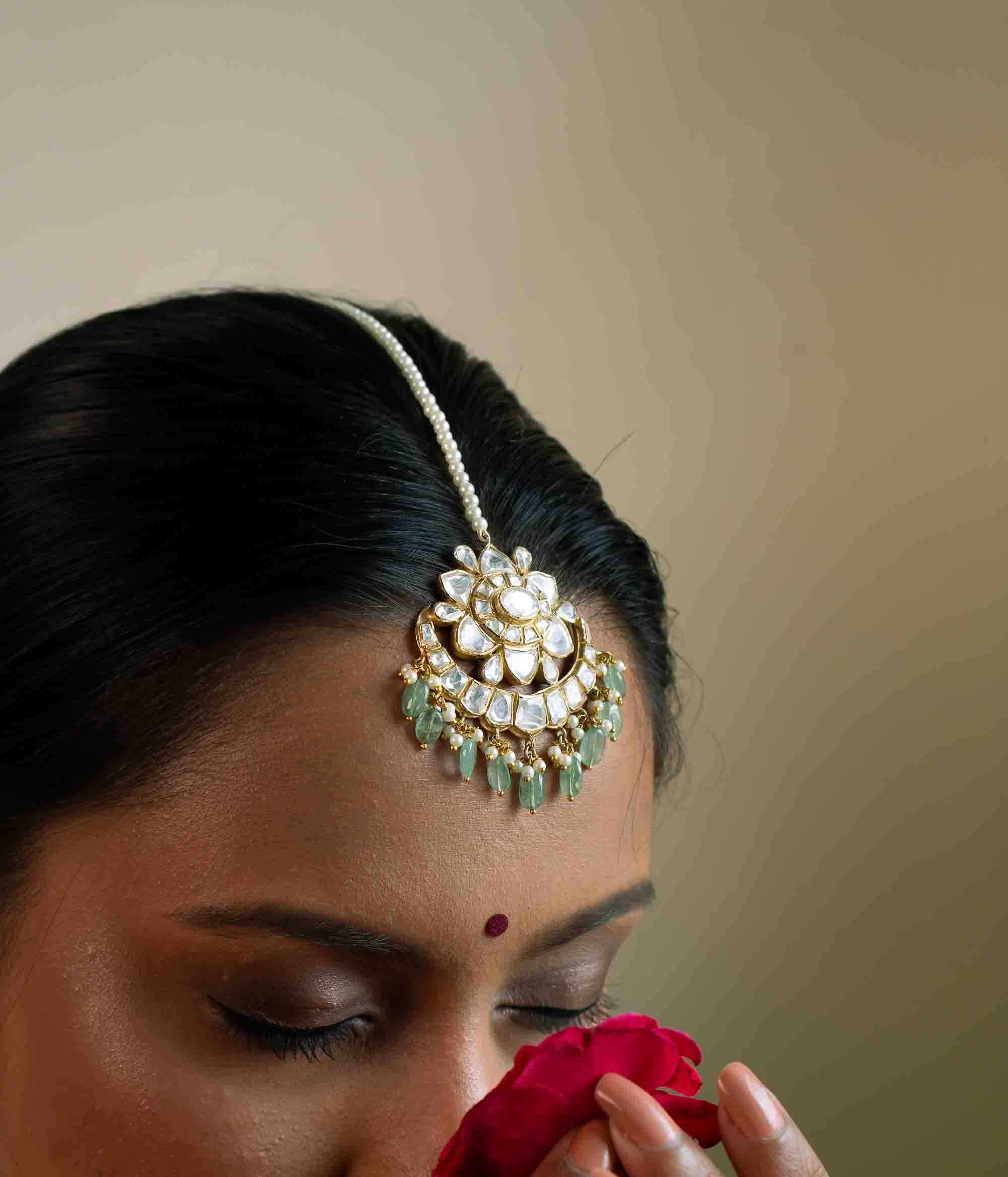 Bridal Polki earrings with dangling green stones and pearls