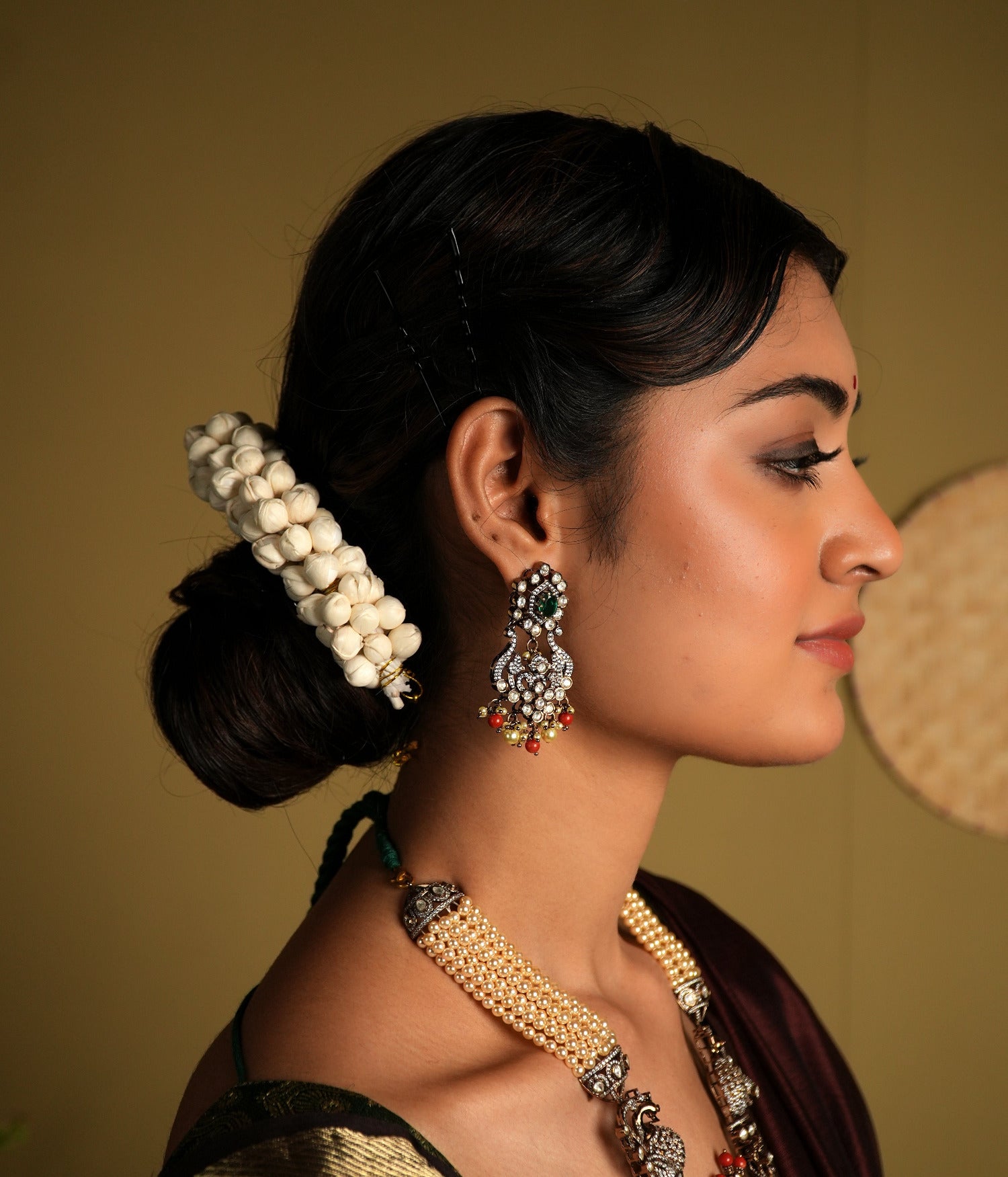 Crafted from 92.5 sterling silver, these exquisite gold-plated Victorian-style earrings feature intricate detailing with delicate floral motifs. Embellished with sparkling stones and colorful bead accents, they bring a regal charm to any traditional outfit. Perfect for weddings, festive occasions, or adding a statement to your ethnic wardrobe.