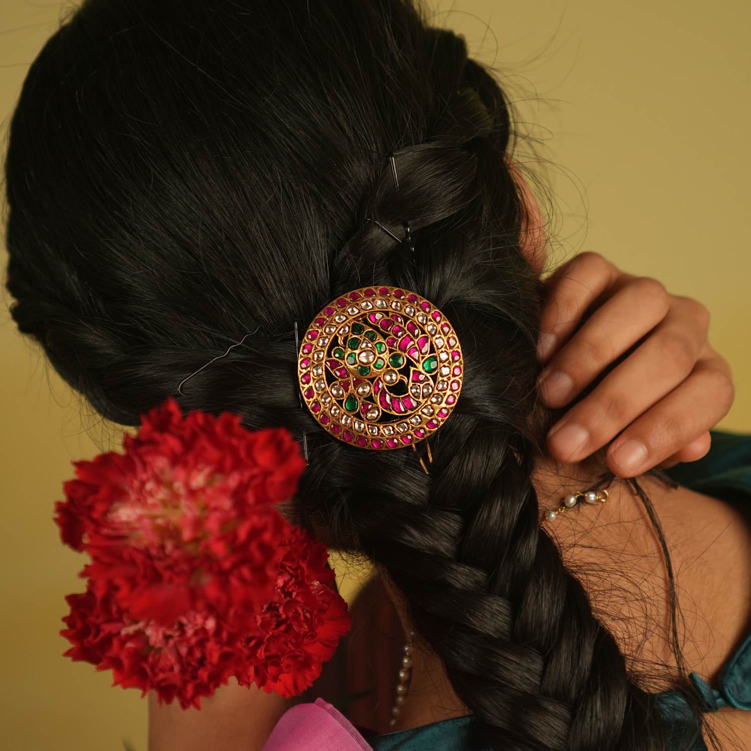 Gracefully worn, this hairpin adorned with red and white Kundan stones enhances any hairstyle, reflecting the beauty of timeless craftsmanship.
