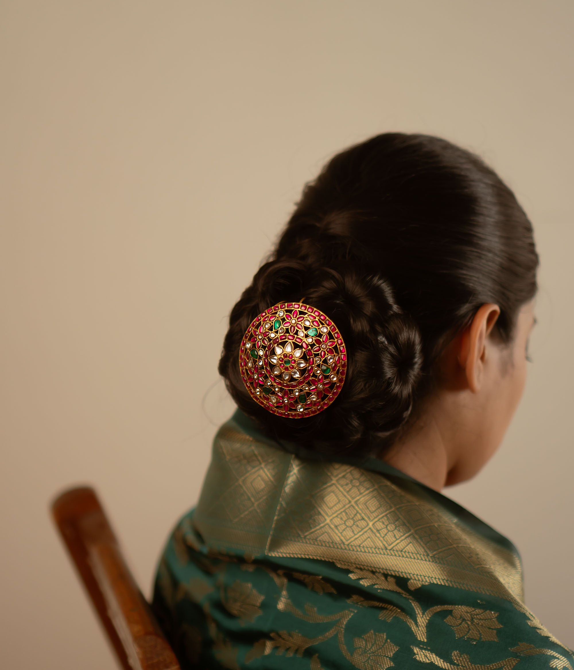 This exquisite hairpin, adorned with red, white, and green kundan stones, radiates timeless elegance. Handcrafted in gold-plated silver, it is a striking blend of tradition and sophistication.