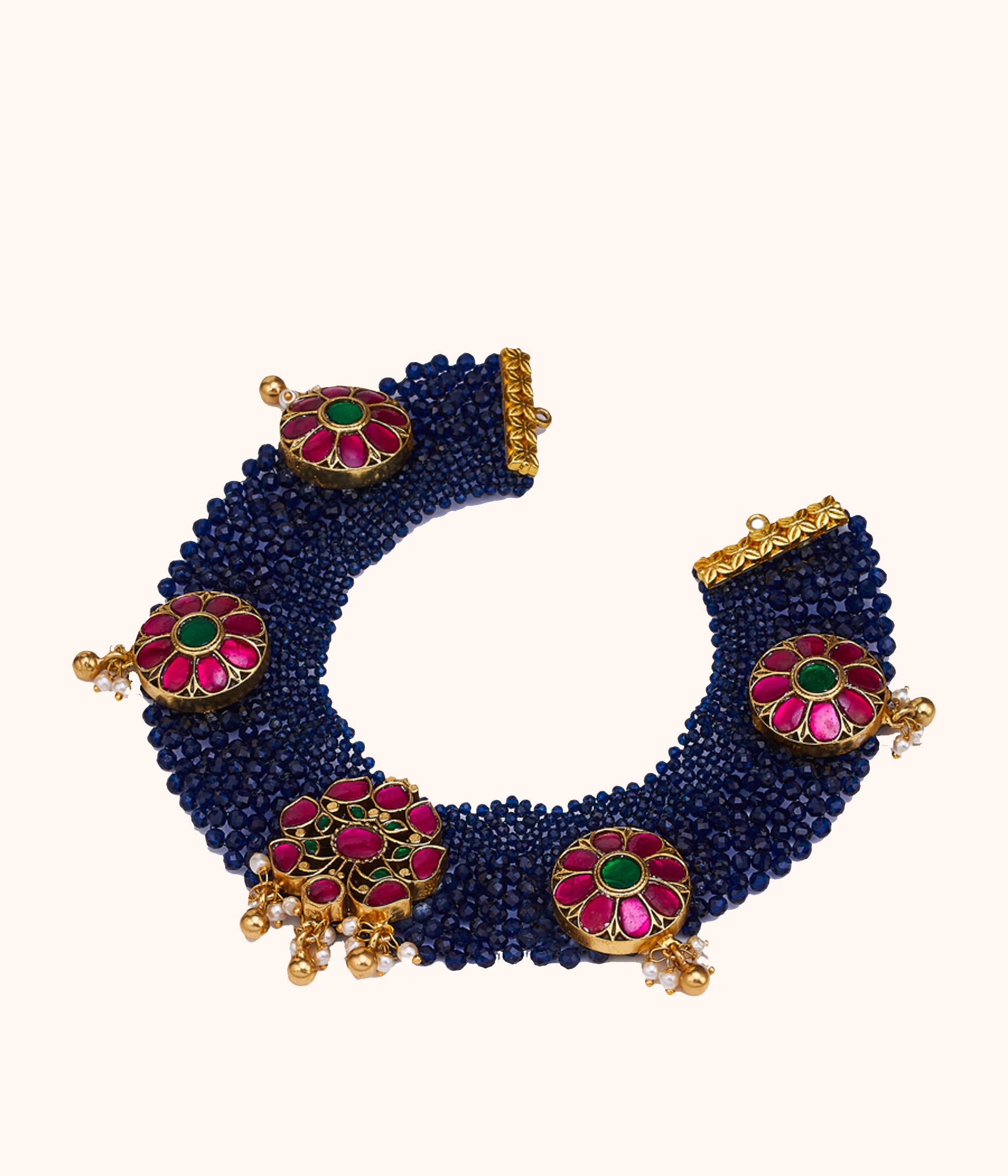 Close-up of Red and Green Kundan Necklace with Blue Beads