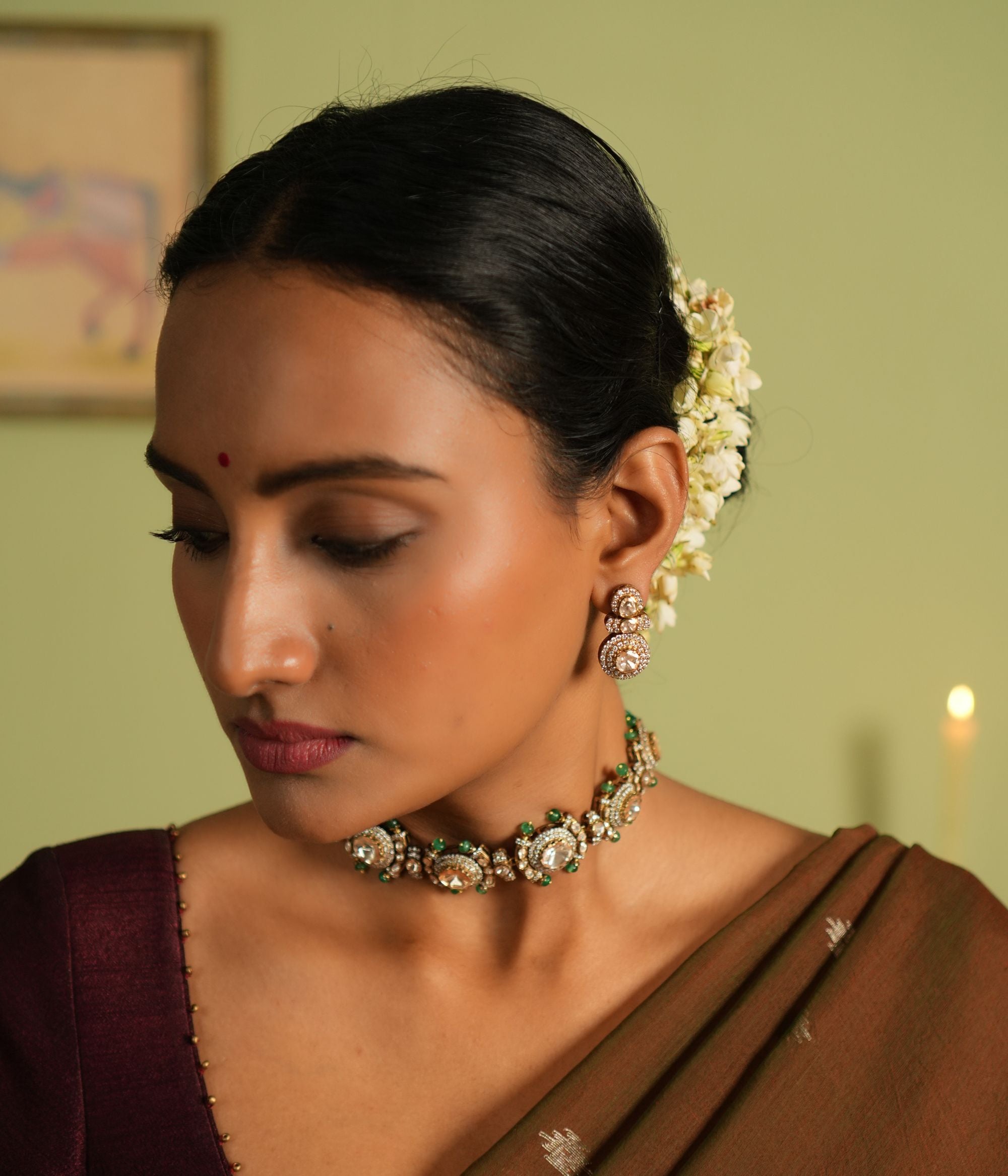 Elegant silver earrings with gold plating, adorned with sparkling Polki stones and shimmering cubic zirconia (CZ) stones. These earrings feature a timeless design, combining traditional craftsmanship with a modern touch, perfect for elevating any outfit.