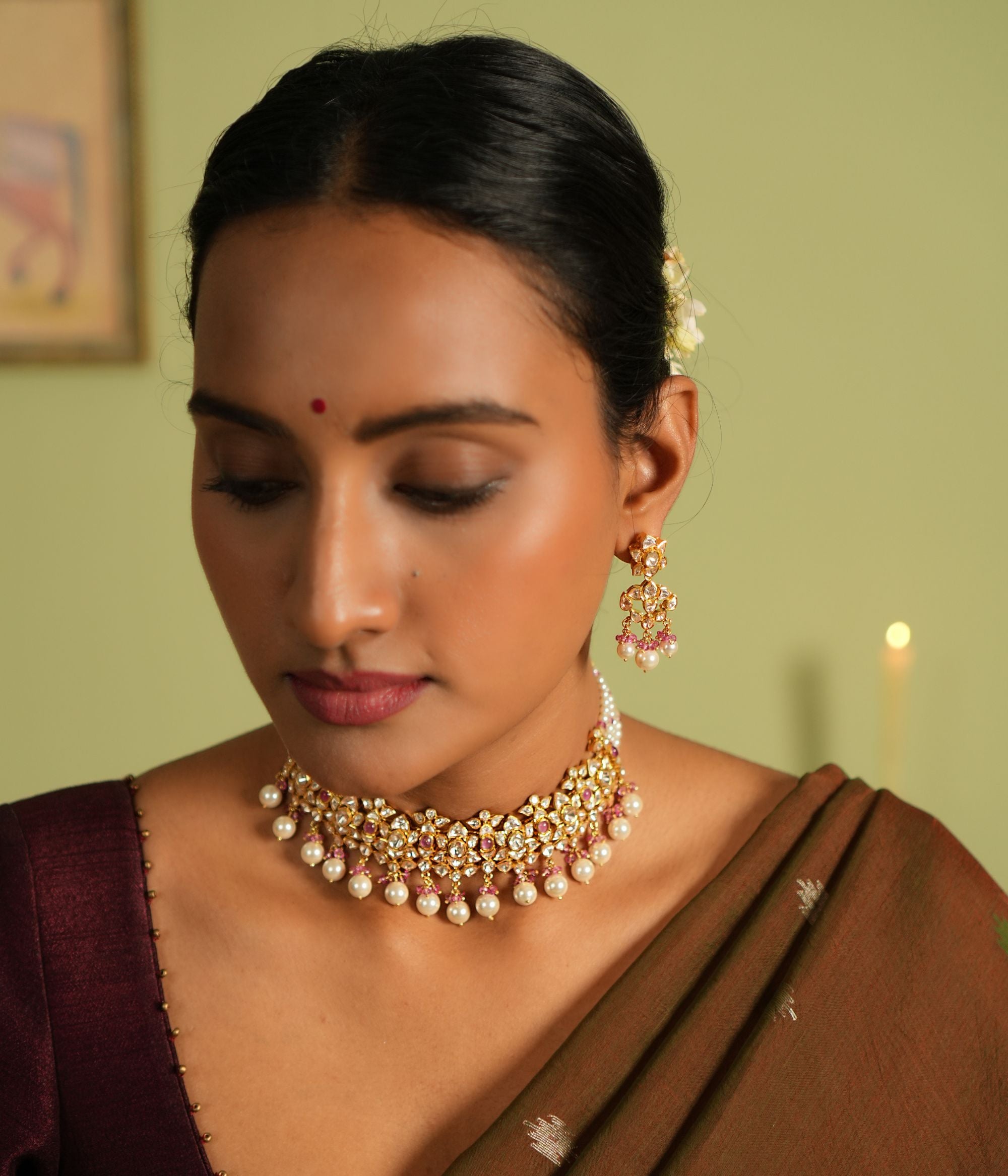 Elegant silver earrings with gold plating, adorned with shimmering Polki stones, white pearl drops, and delicate pink pearls, creating a sophisticated and feminine design perfect for any occasion.