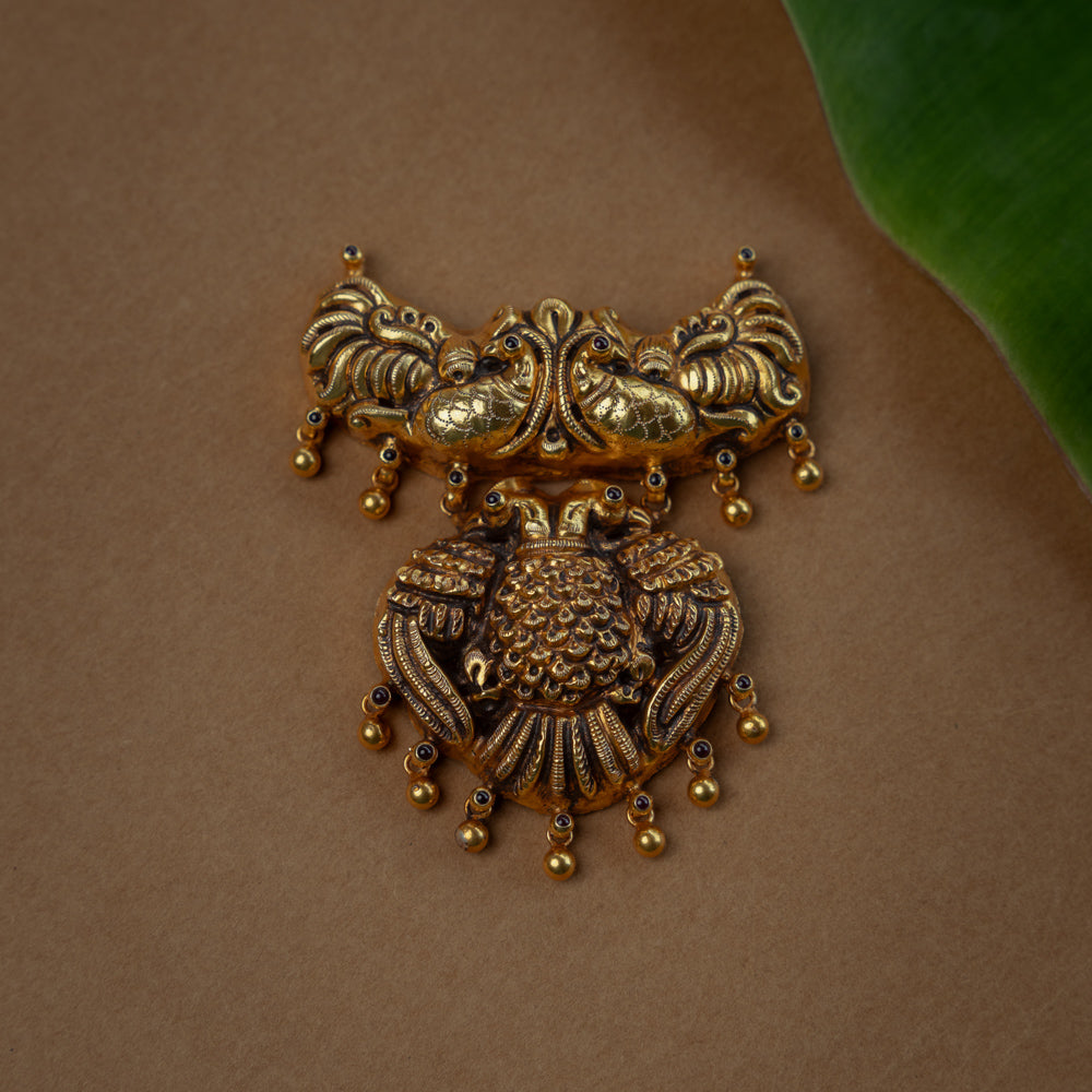 Temple Pendant with Red Spinal Stone, themed around Peacock.