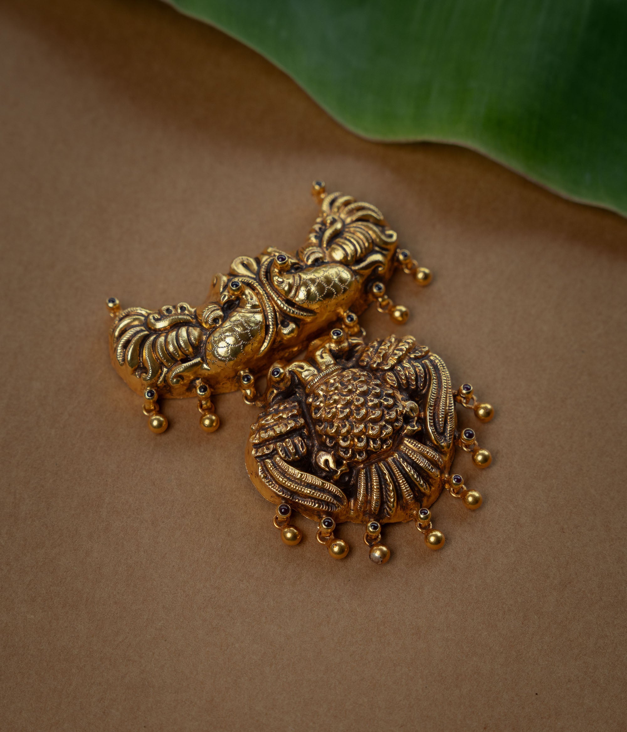 Temple Pendant with Red Spinal Stone, themed around Peacock.