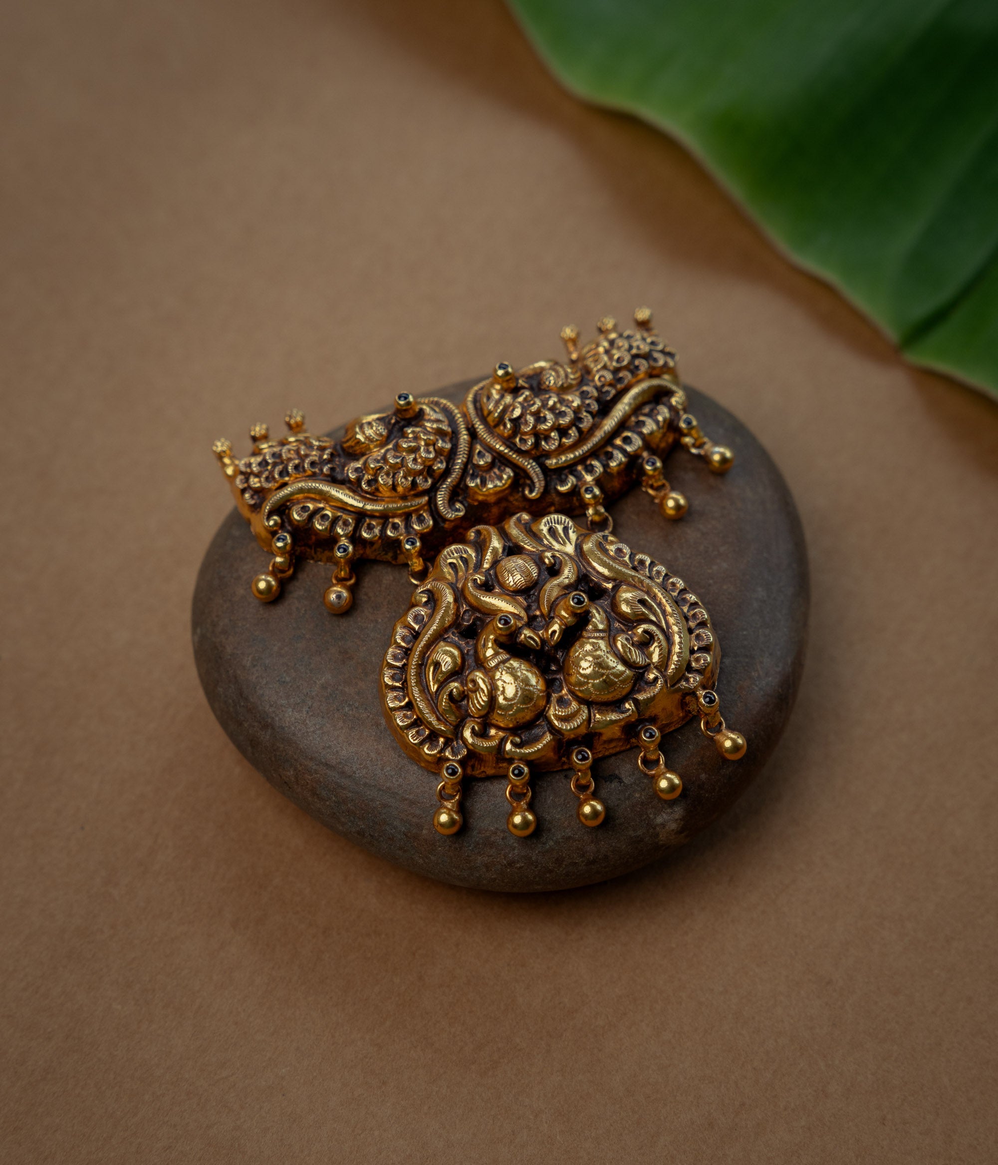 Temple Pendant with Red Spinal Stone, themed around Floral.