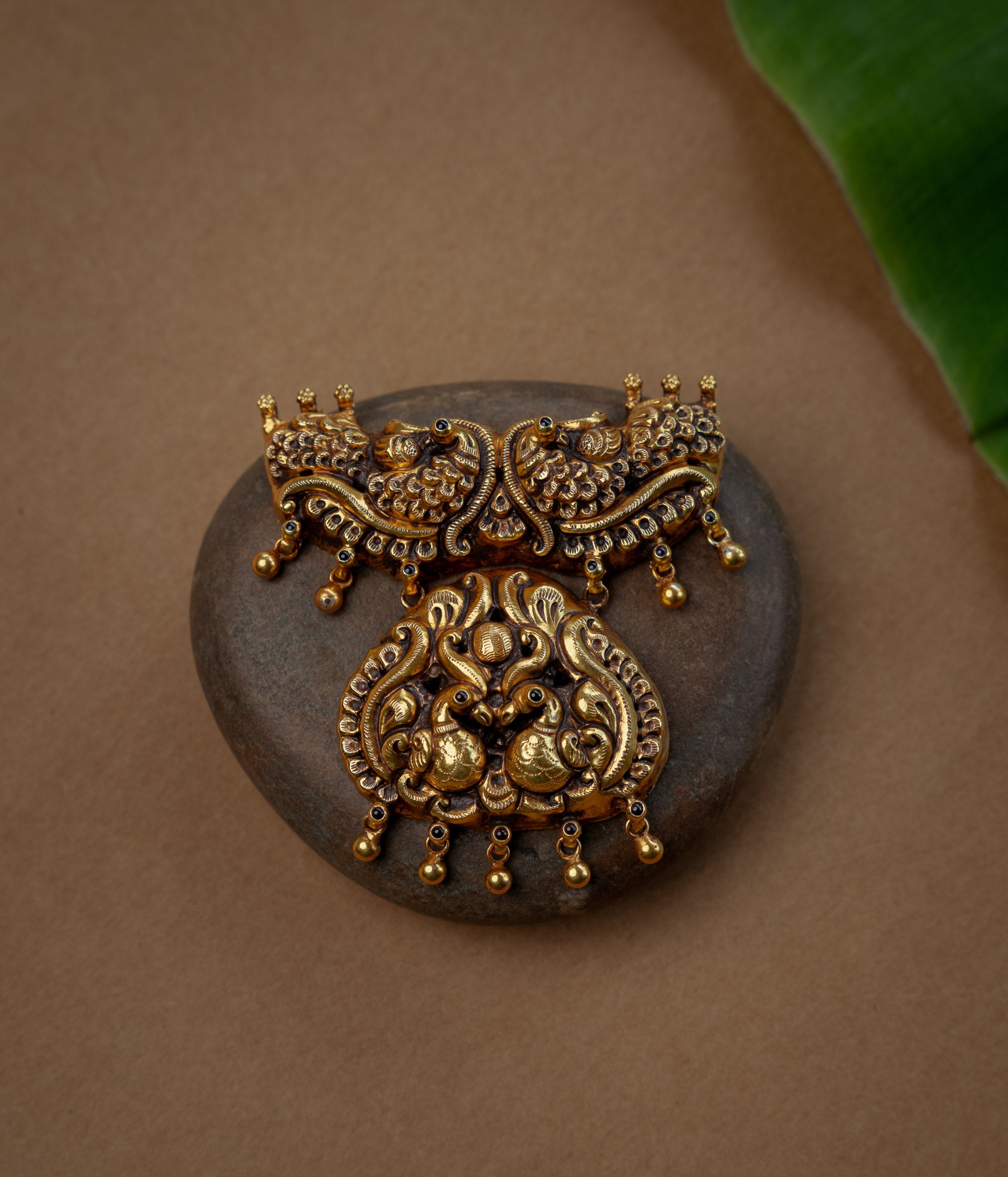 Temple Pendant with Red Spinal Stone, themed around Floral.