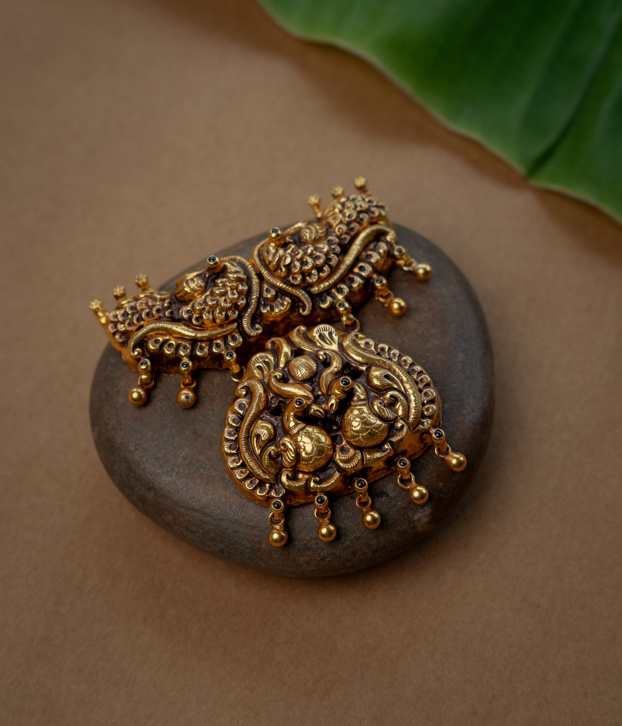 Temple Pendant with Red Spinal Stone, themed around Floral.