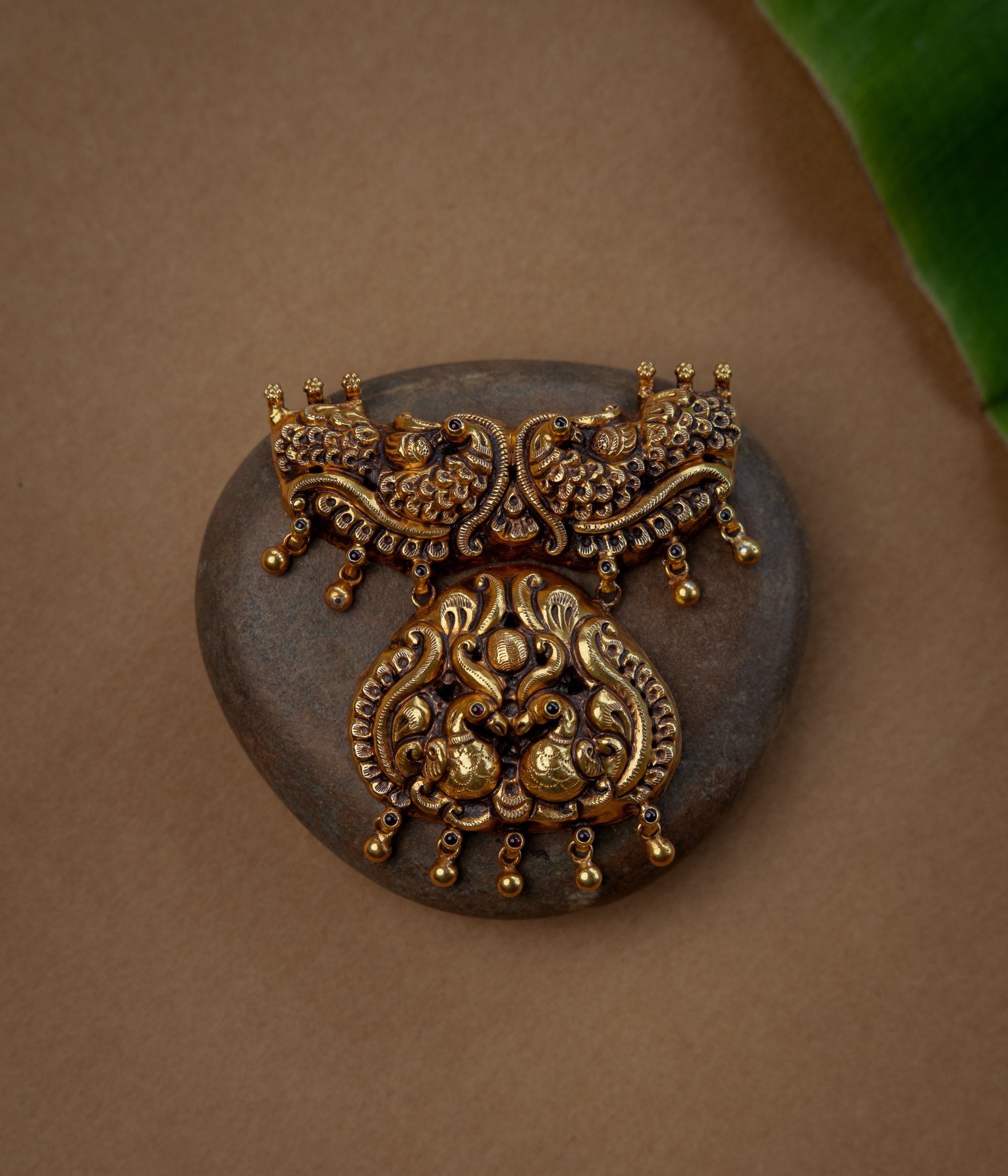 Temple Pendant with Red Spinal Stone, themed around Floral.