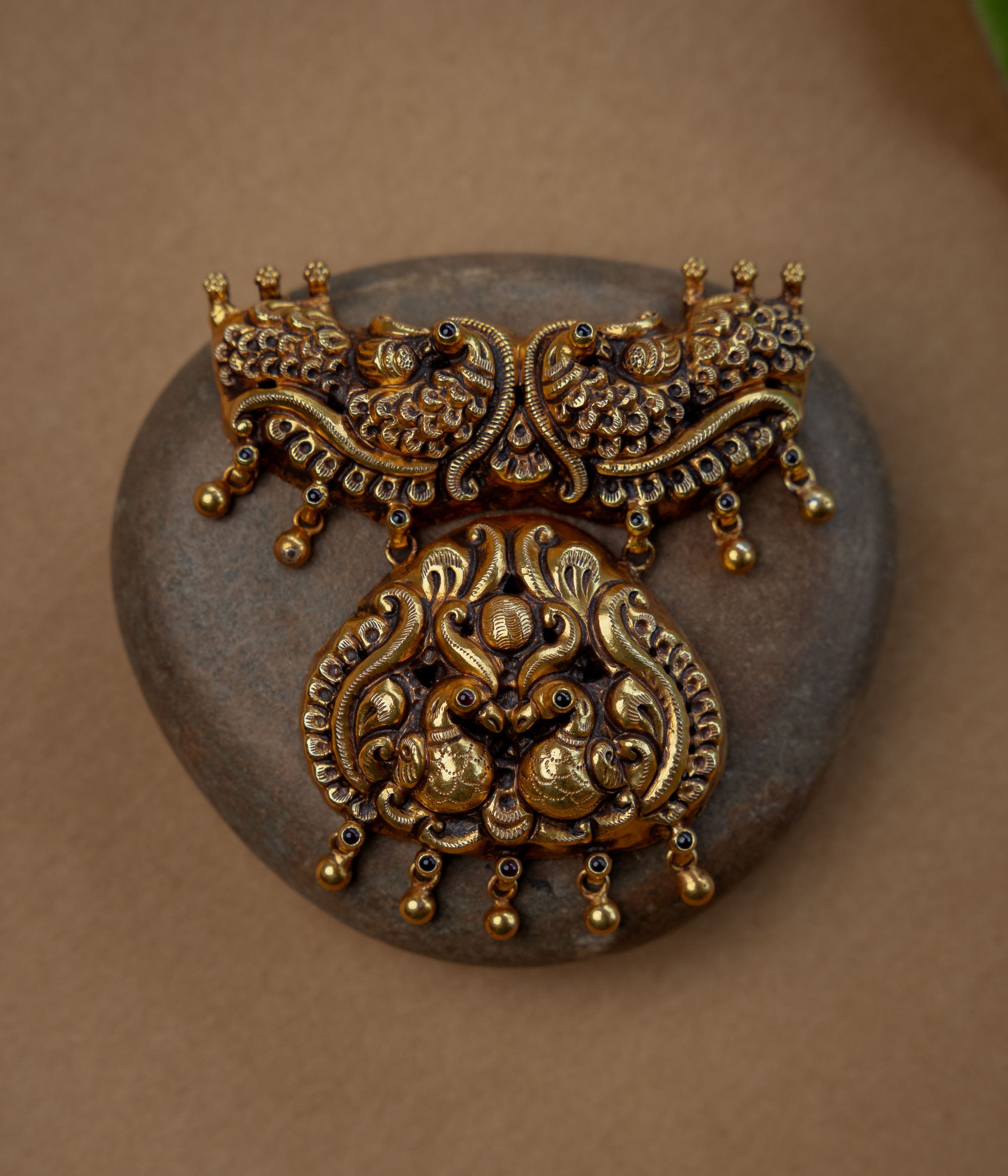 Temple Pendant with Red Spinal Stone, themed around Floral.