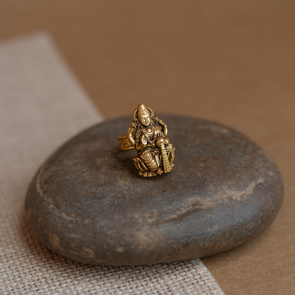 Temple ring with red Spinal stone in traditional temple-inspired design.