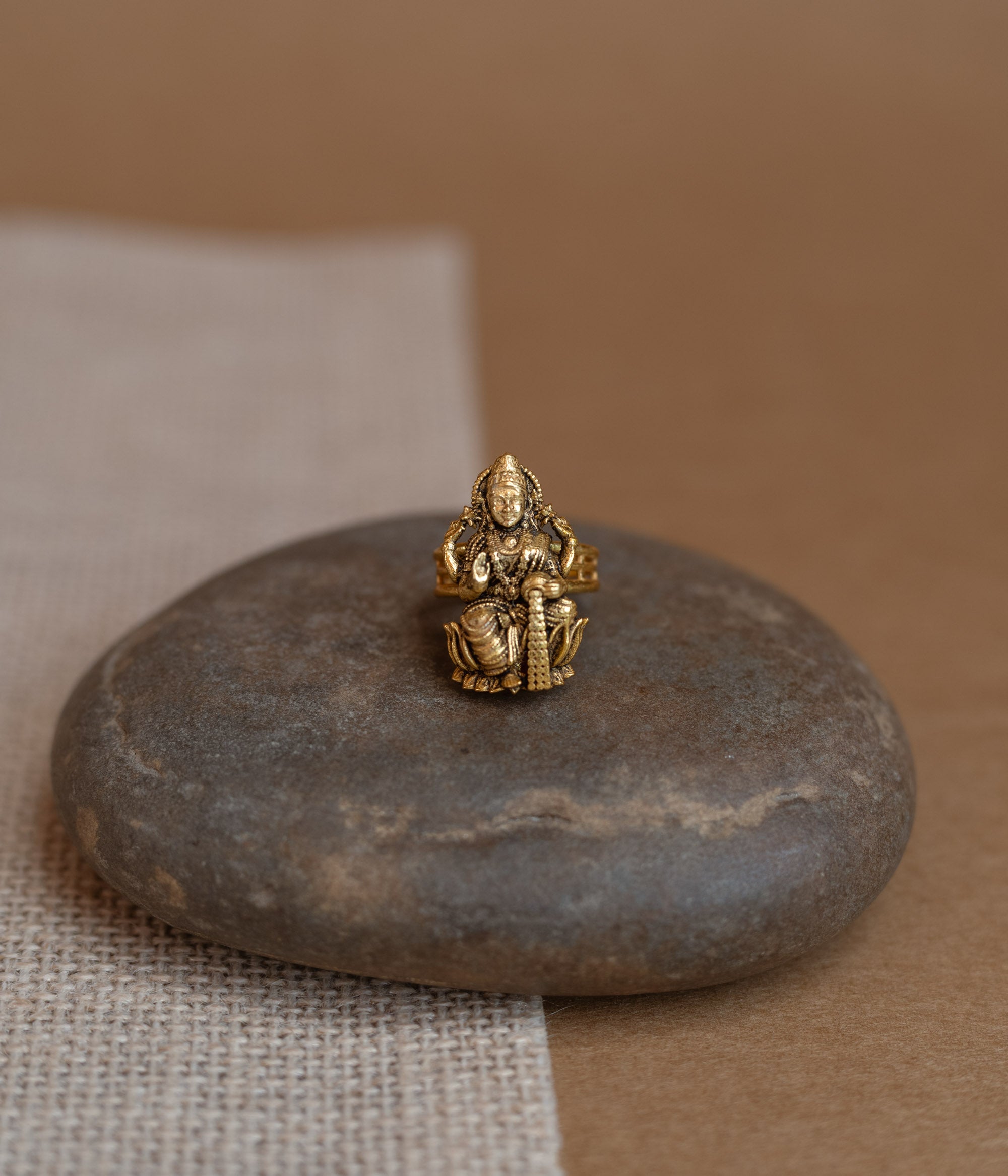 Temple ring with red Spinal stone in traditional temple-inspired design.