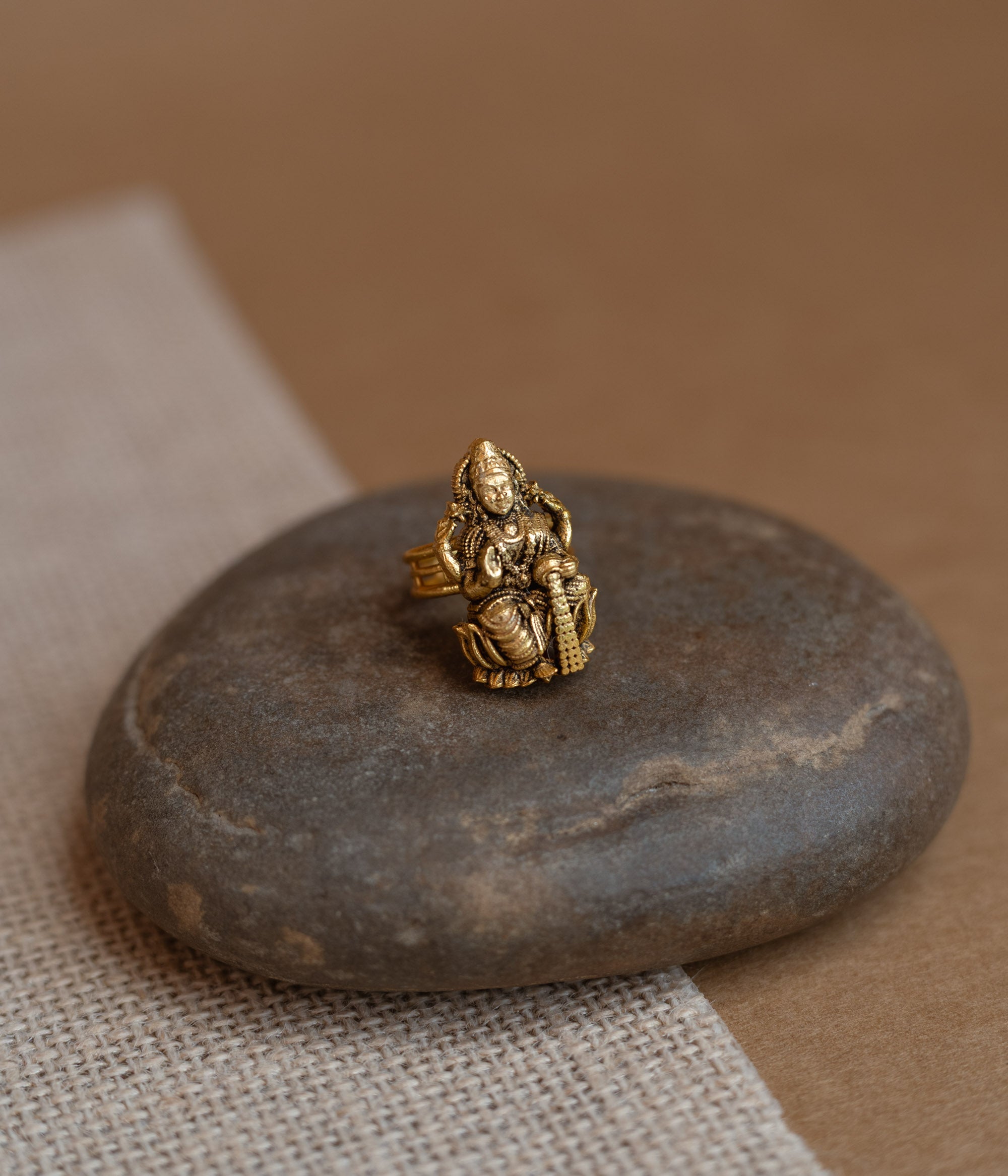 Temple ring with red Spinal stone in traditional temple-inspired design.