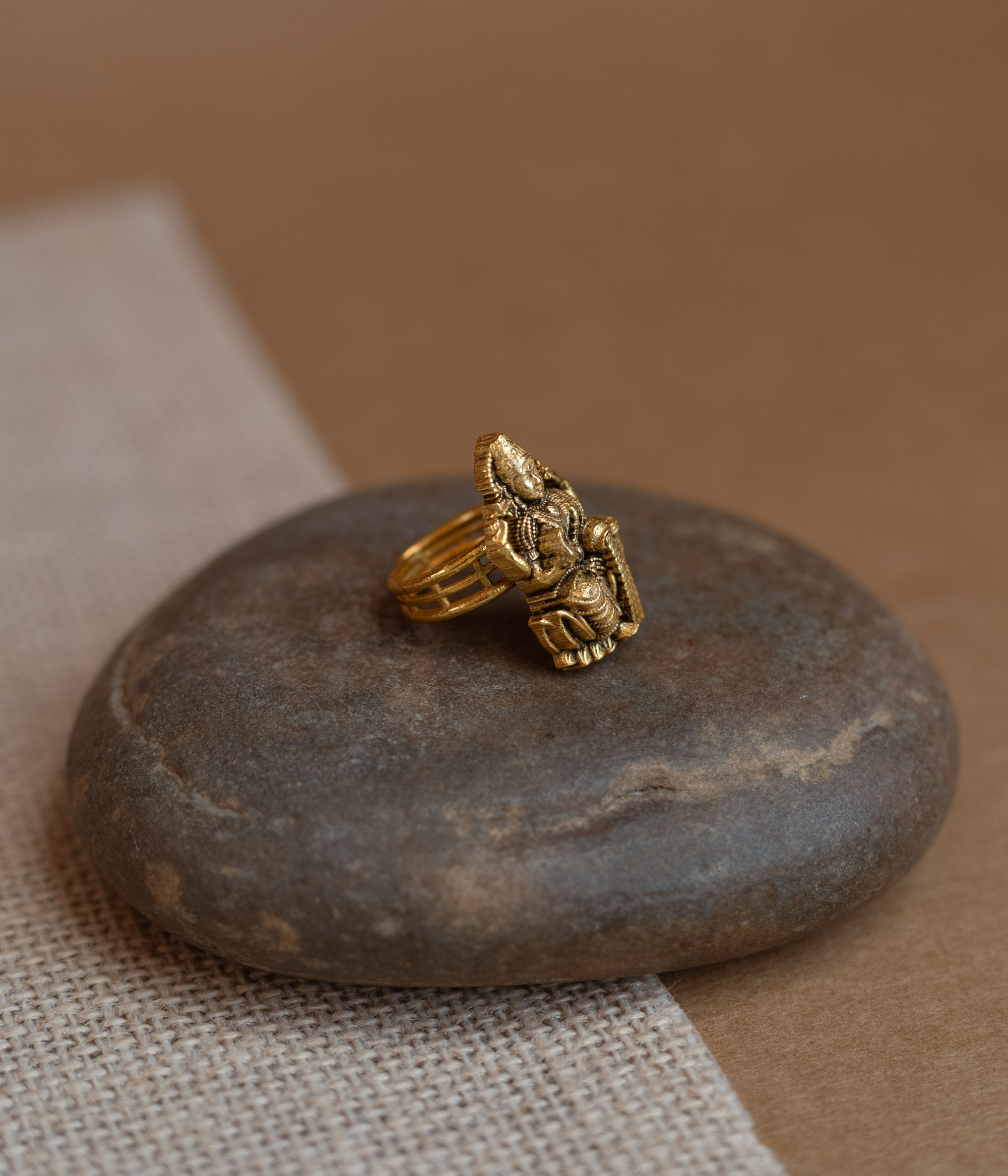 Temple ring with red Spinal stone in traditional temple-inspired design.