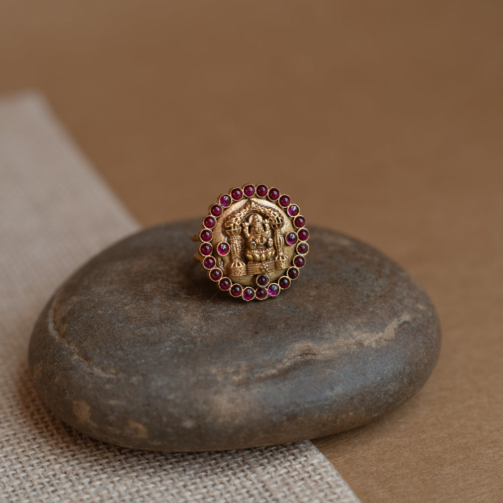 Temple collection ring with white Polki stone and golden finish design.