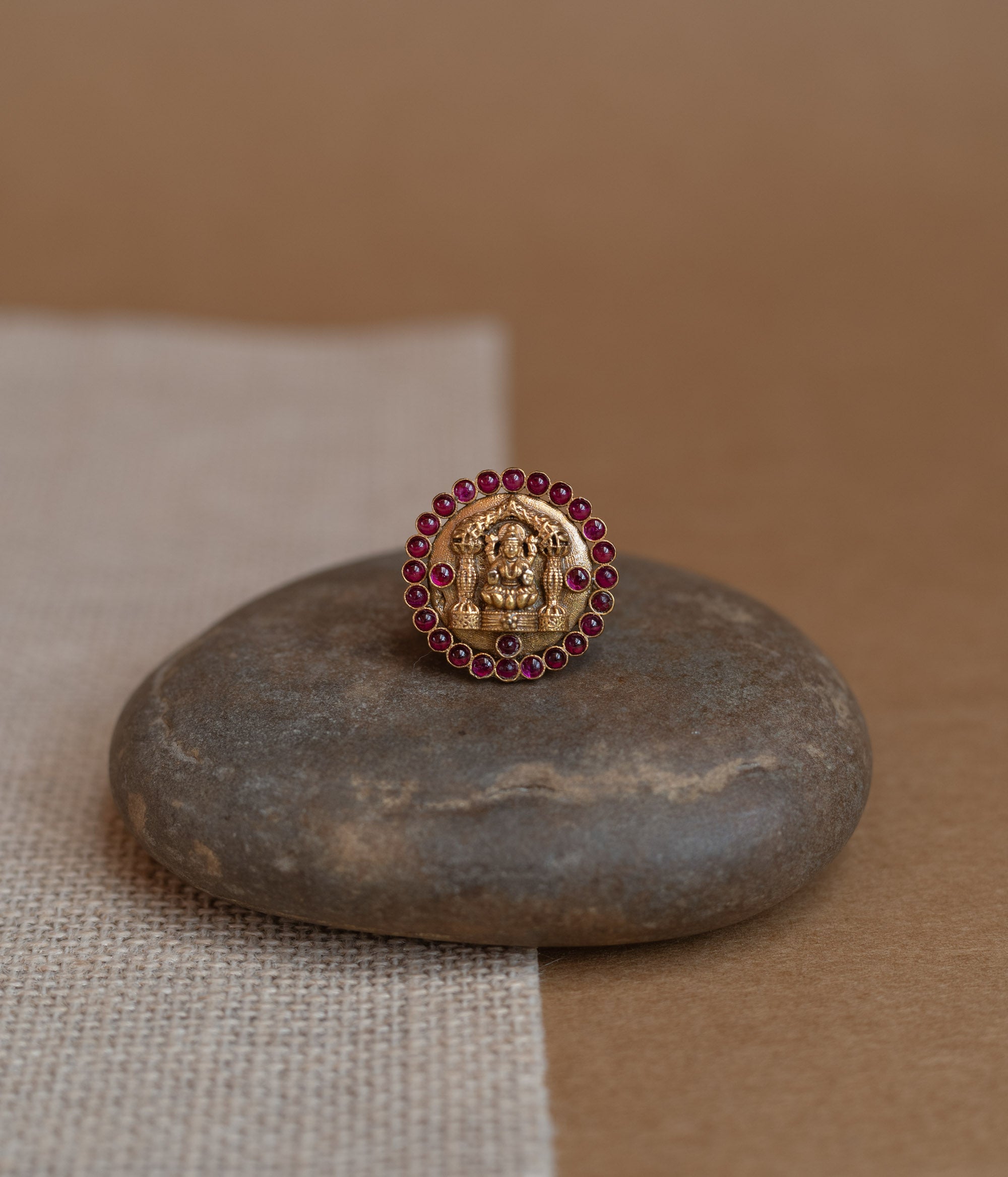 Temple collection ring with white Polki stone and golden finish design.