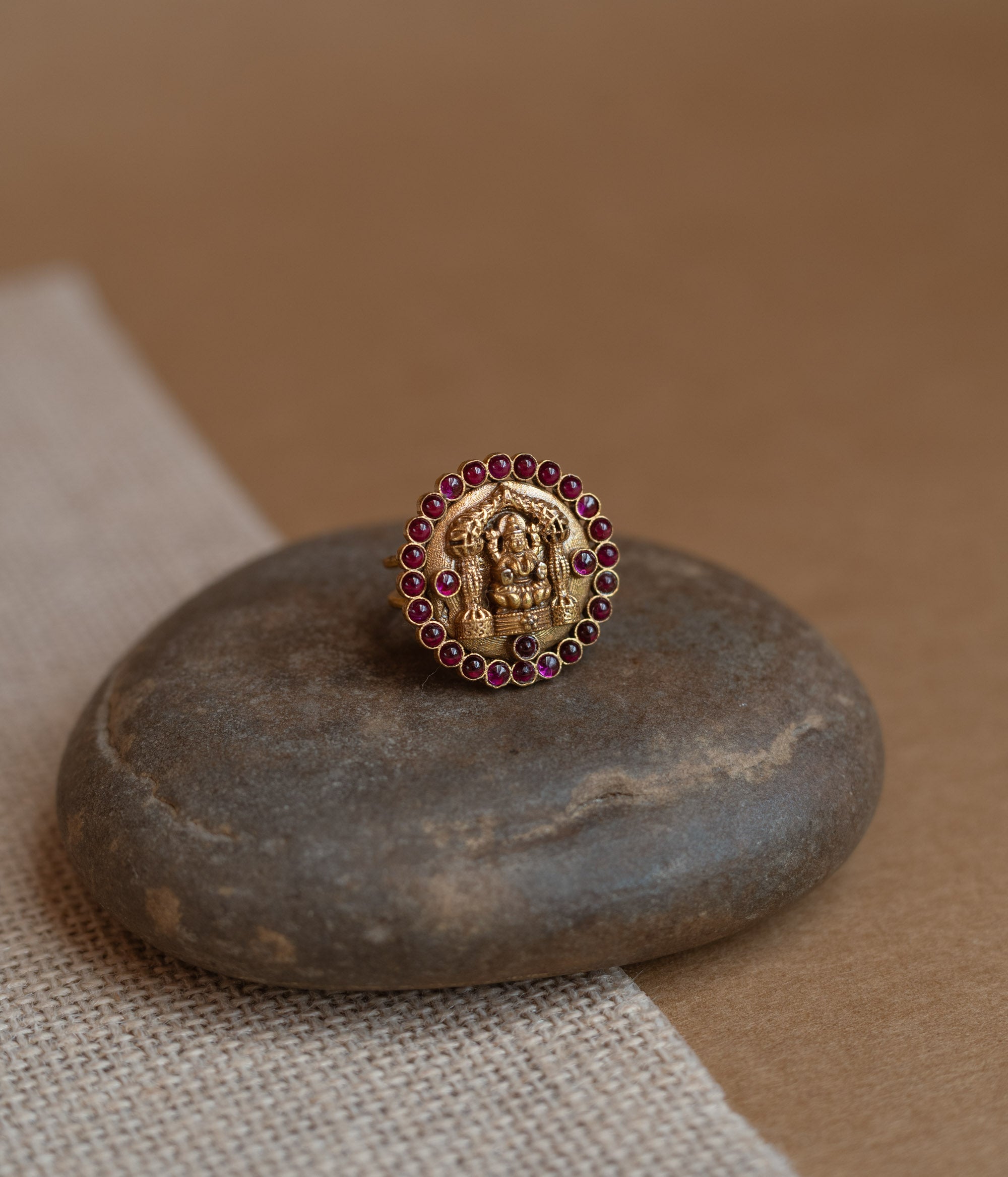 Temple collection ring with white Polki stone and golden finish design.
