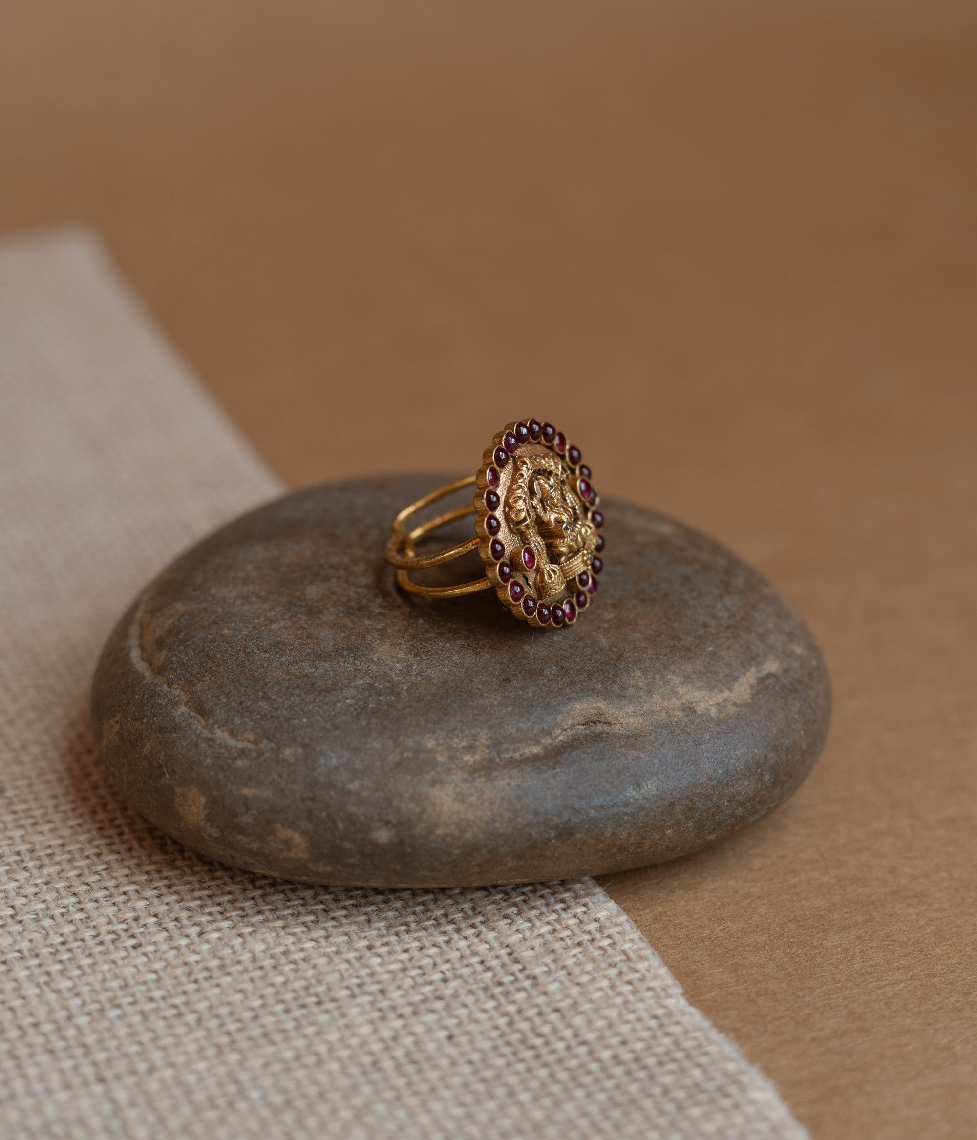 Temple collection ring with white Polki stone and golden finish design.