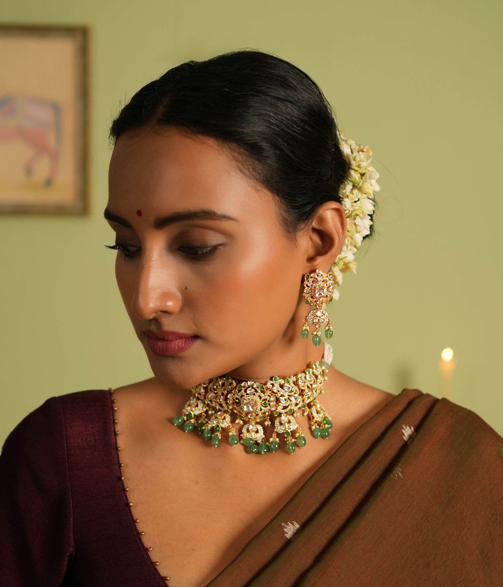 Graceful dangler earrings crafted in silver with a gold-plated finish, featuring intricate Polki stones, vibrant strawberry quartz, and sparkling CZ stones for a stunning and timeless design.