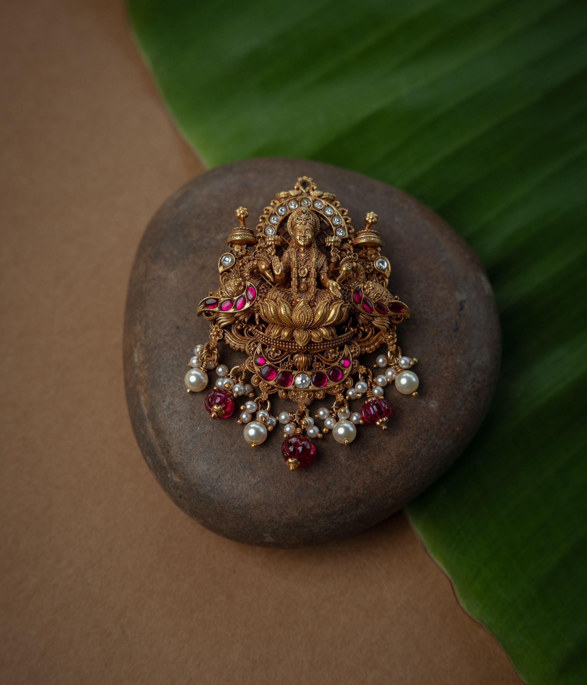 Close up view of Ashta silver pendant detailing