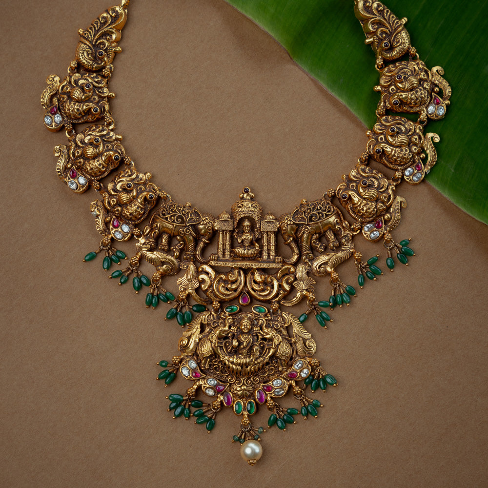 Ornate temple kundan and pearl necklace