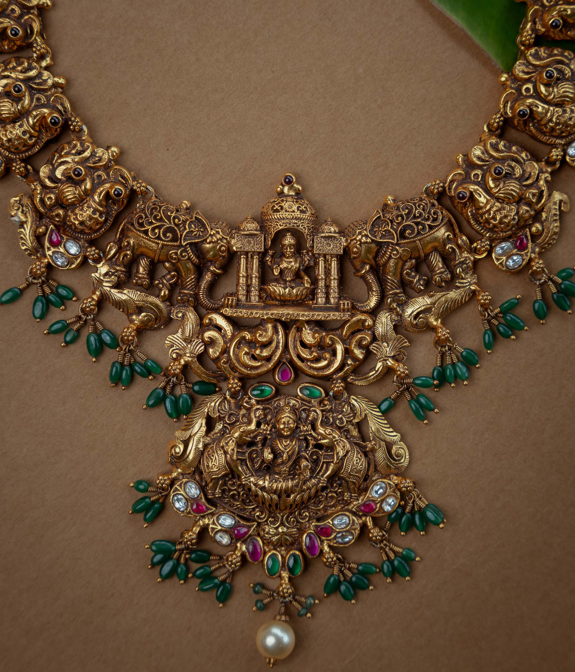Ornate temple kundan and pearl necklace