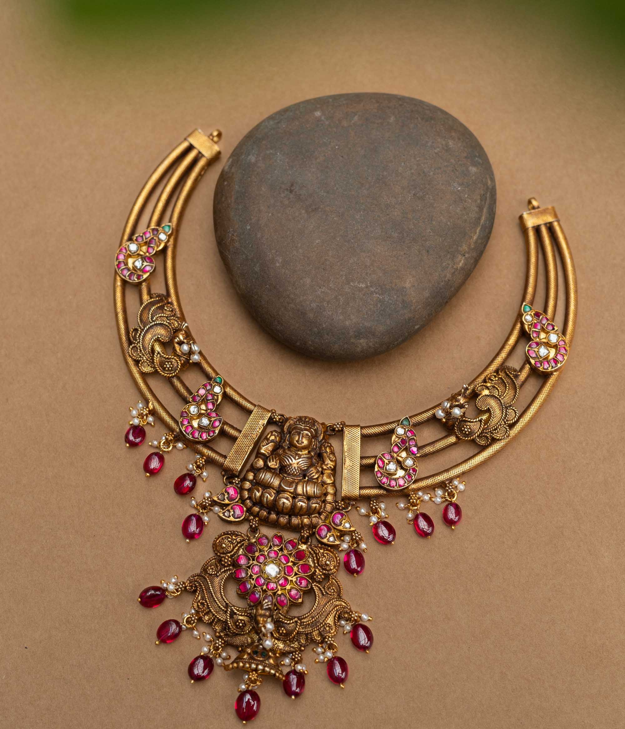 A majestic 92.5 sterling silver Meenakshi Temple Heritage Necklace, featuring a grand Lakshmi pendant, ruby red drops, and intricate meenakari paisley motifs, radiating divine elegance and royal charm for bridal and festive wear.