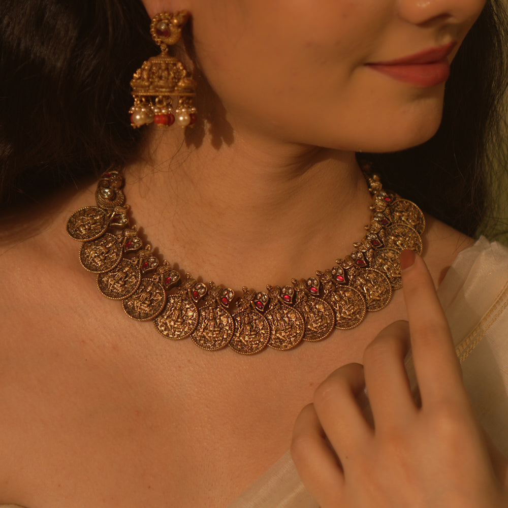 Temple collection Shyla Necklace featuring kasu coin motifs, pink Kundan stones, and divine Goddess Lakshmi-inspired design.