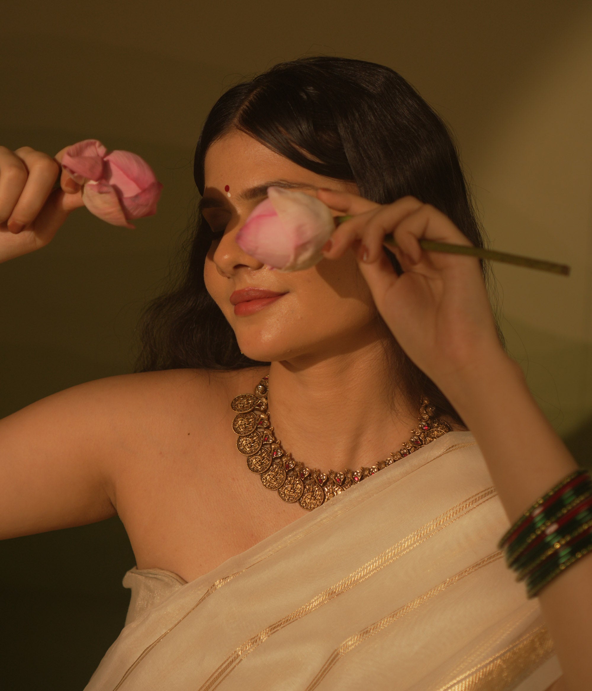 Temple collection Shyla Necklace featuring kasu coin motifs, pink Kundan stones, and divine Goddess Lakshmi-inspired design.