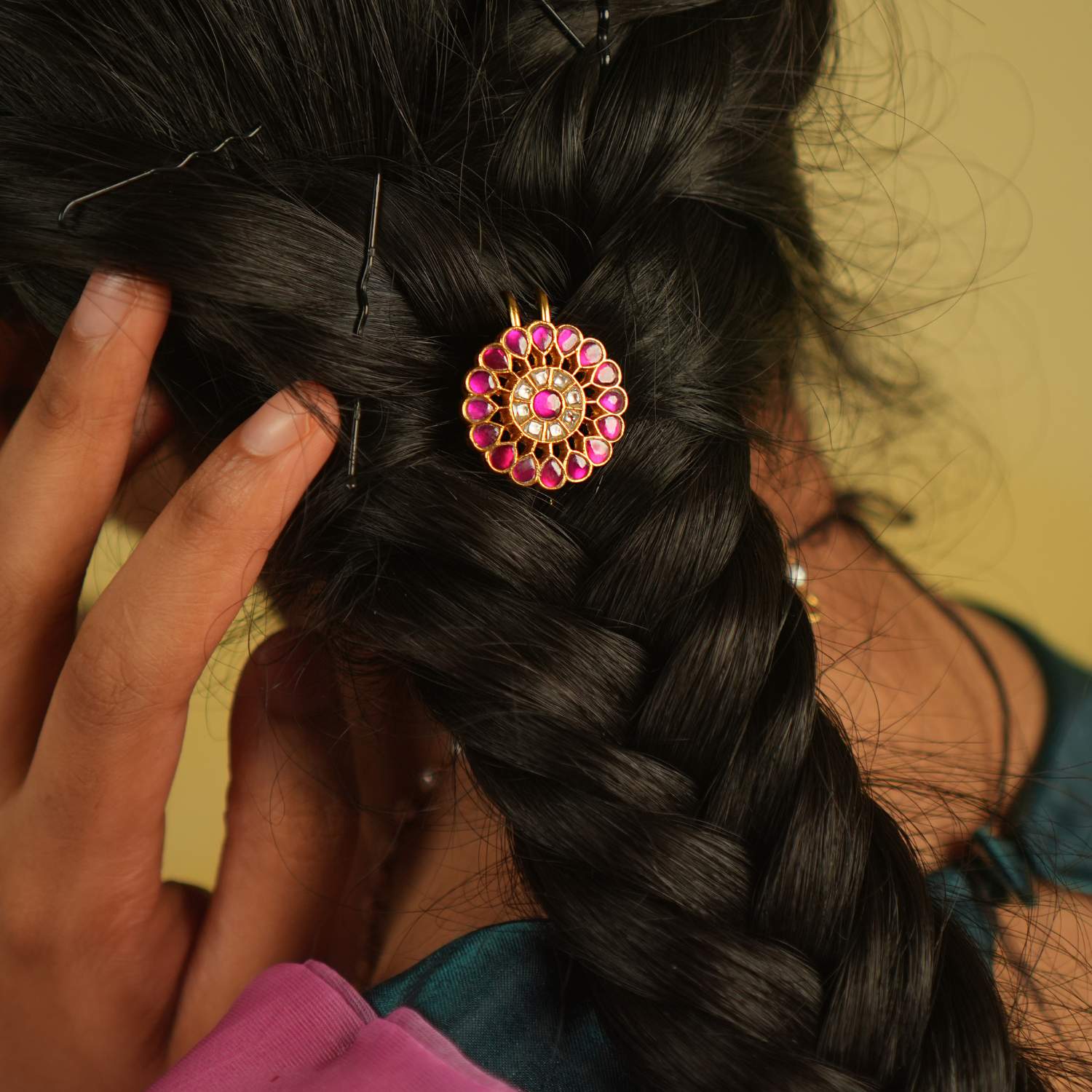 Gracefully worn, this hairpin adorned with red and white Kundan stones enhances any hairstyle, reflecting the beauty of timeless craftsmanship.