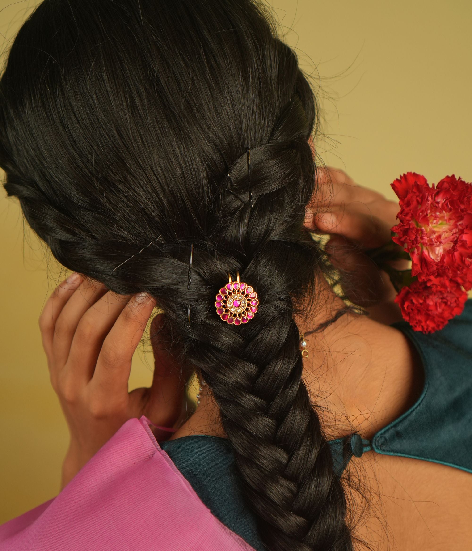 Gracefully worn, this hairpin adorned with red and white Kundan stones enhances any hairstyle, reflecting the beauty of timeless craftsmanship.