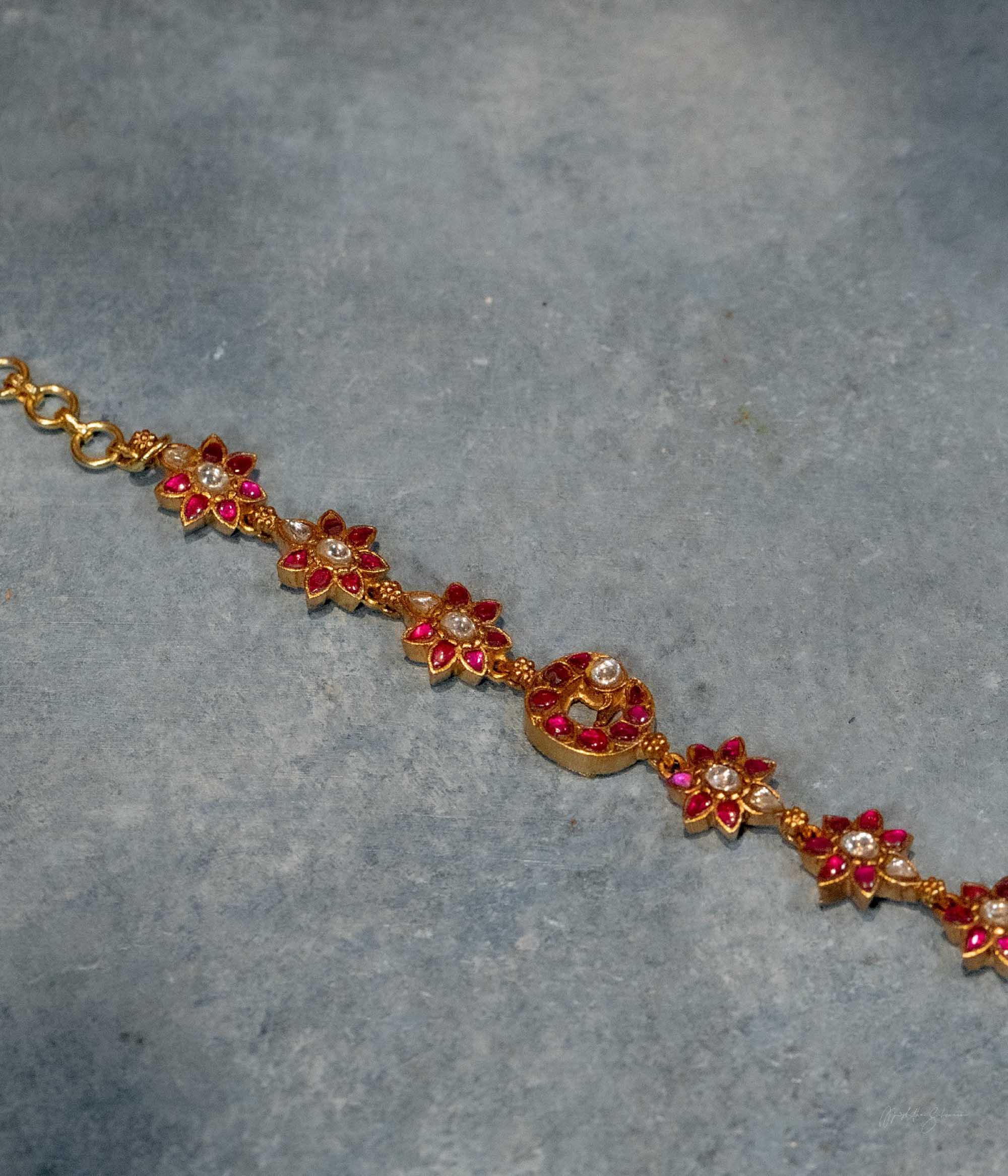 Handcrafted silver bracelet with red white and green kundan stones