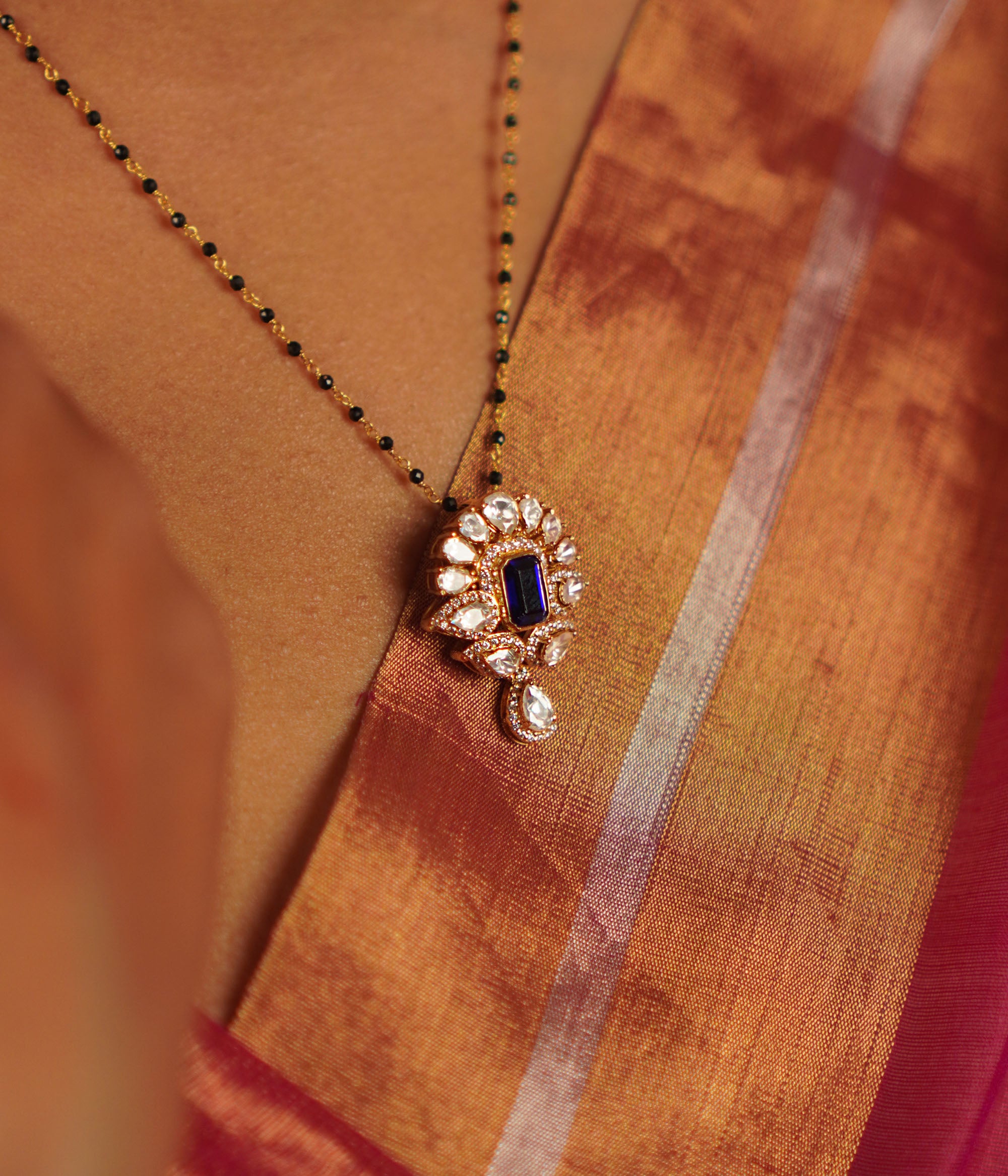 Handcrafted silver mangalsutra pendant with polki and blue gemstone