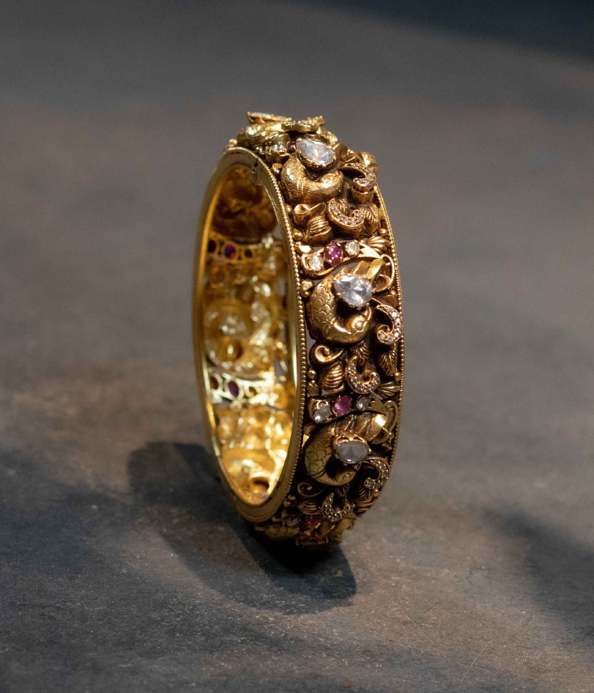 Dhowmya Temple Kada in 92.5 Sterling Silver Gold Plated with Polki Stones