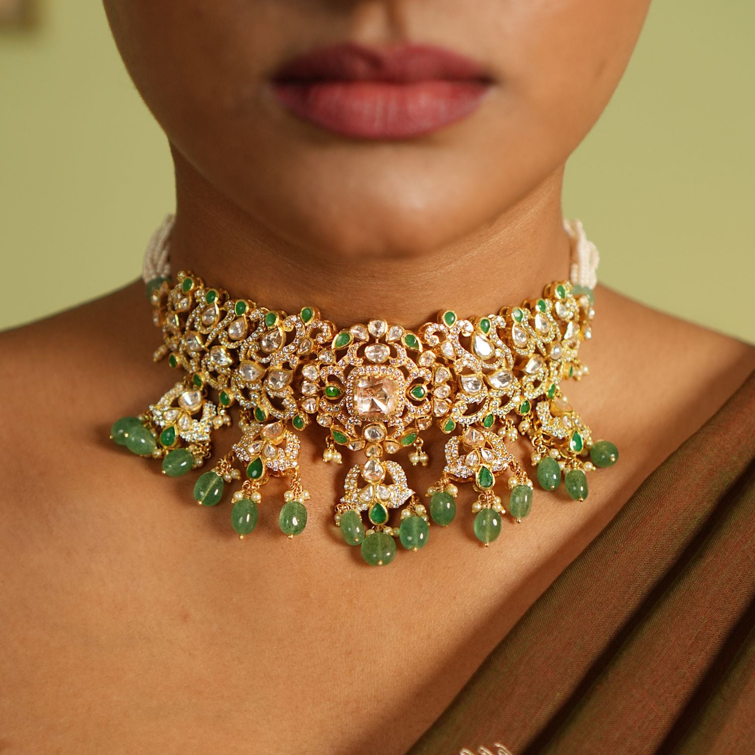 Elegant silver necklace with a gold-plated finish, adorned with intricate Polki stones, vibrant strawberry quartz, and sparkling CZ stones, creating a timeless and sophisticated design perfect for any occasion.